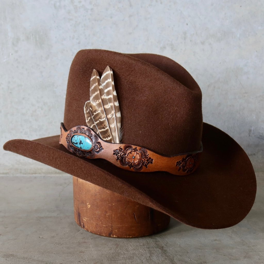 PHYLLi x Buffalo Girl hat band with feather and turquoise detail on a chocolate felt hat