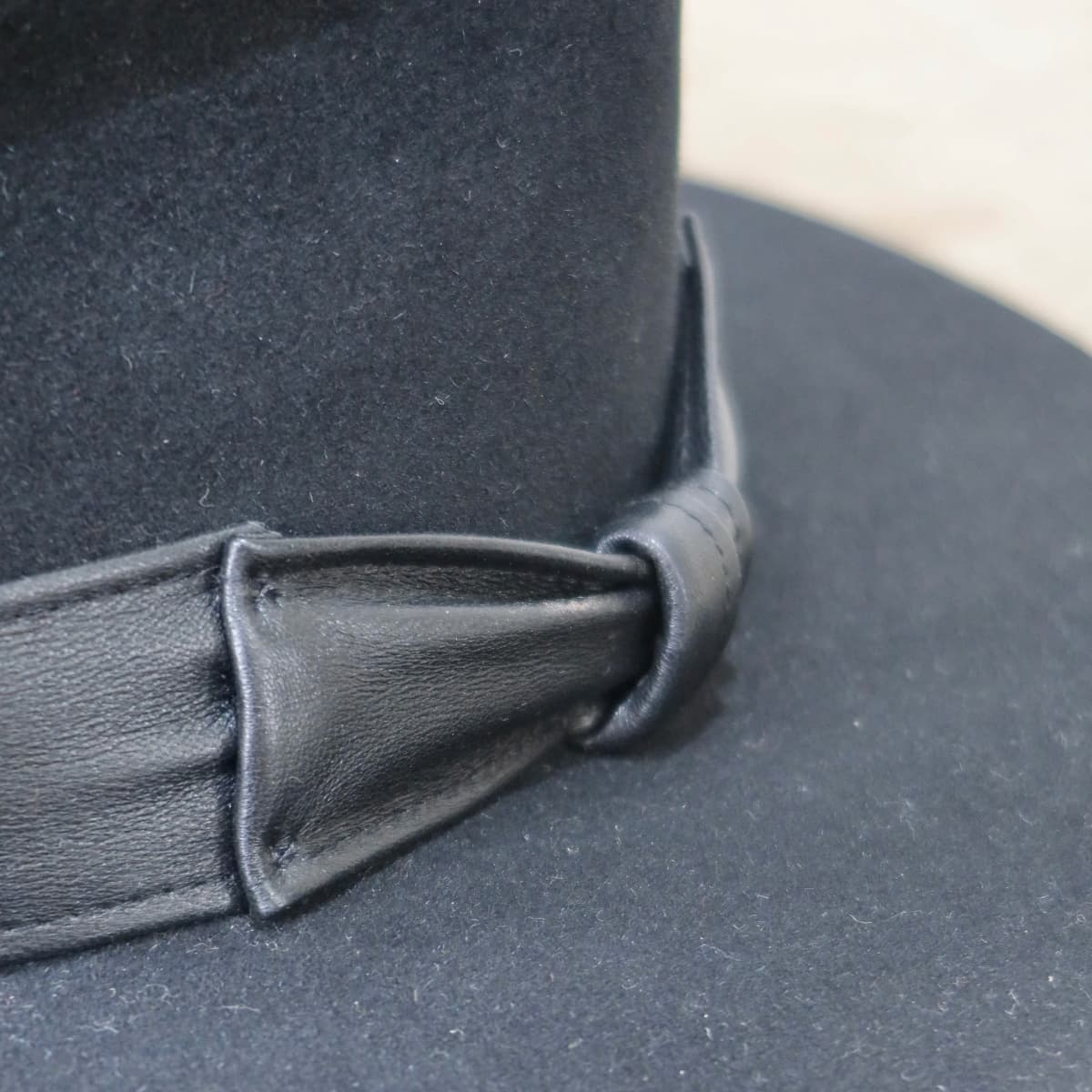 Close up detail of the Kirrilee felt hat showing premium rabbit felt texture and leather bow band.