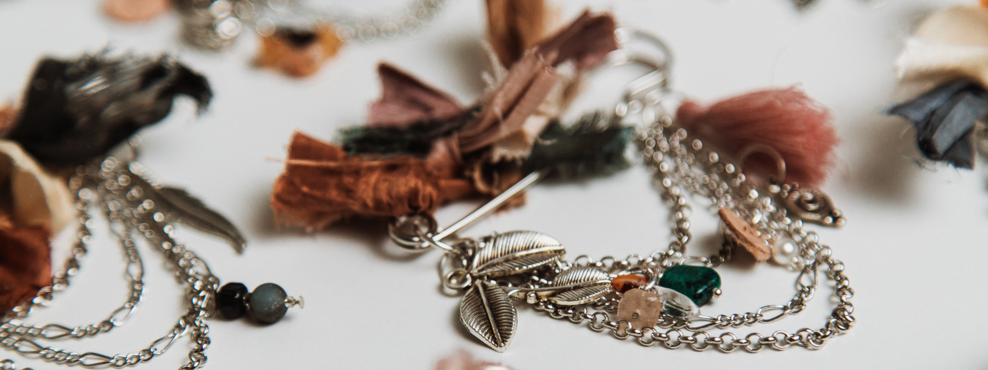 Banner Image | Close-up of silver chunky hat pins – bespoke hat accessories from PHYLLi Designs