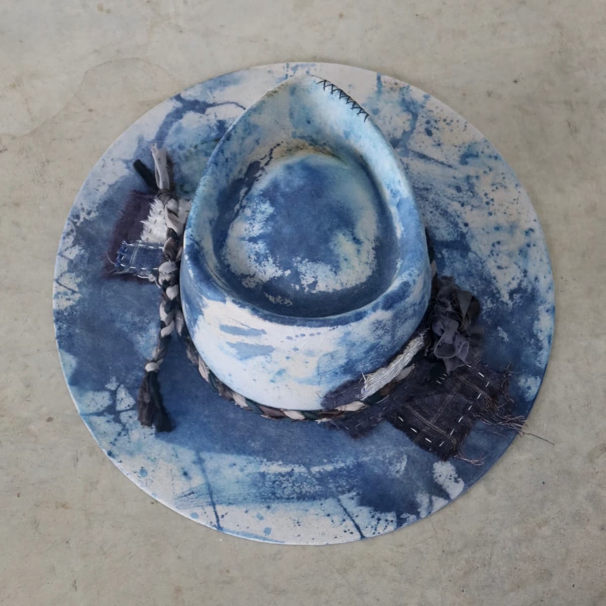 Top down back view of the dove grey indigo tie dye felt hat Aizome Limited Edition by PHYLLi Designs with patchwork and sari silk trim.