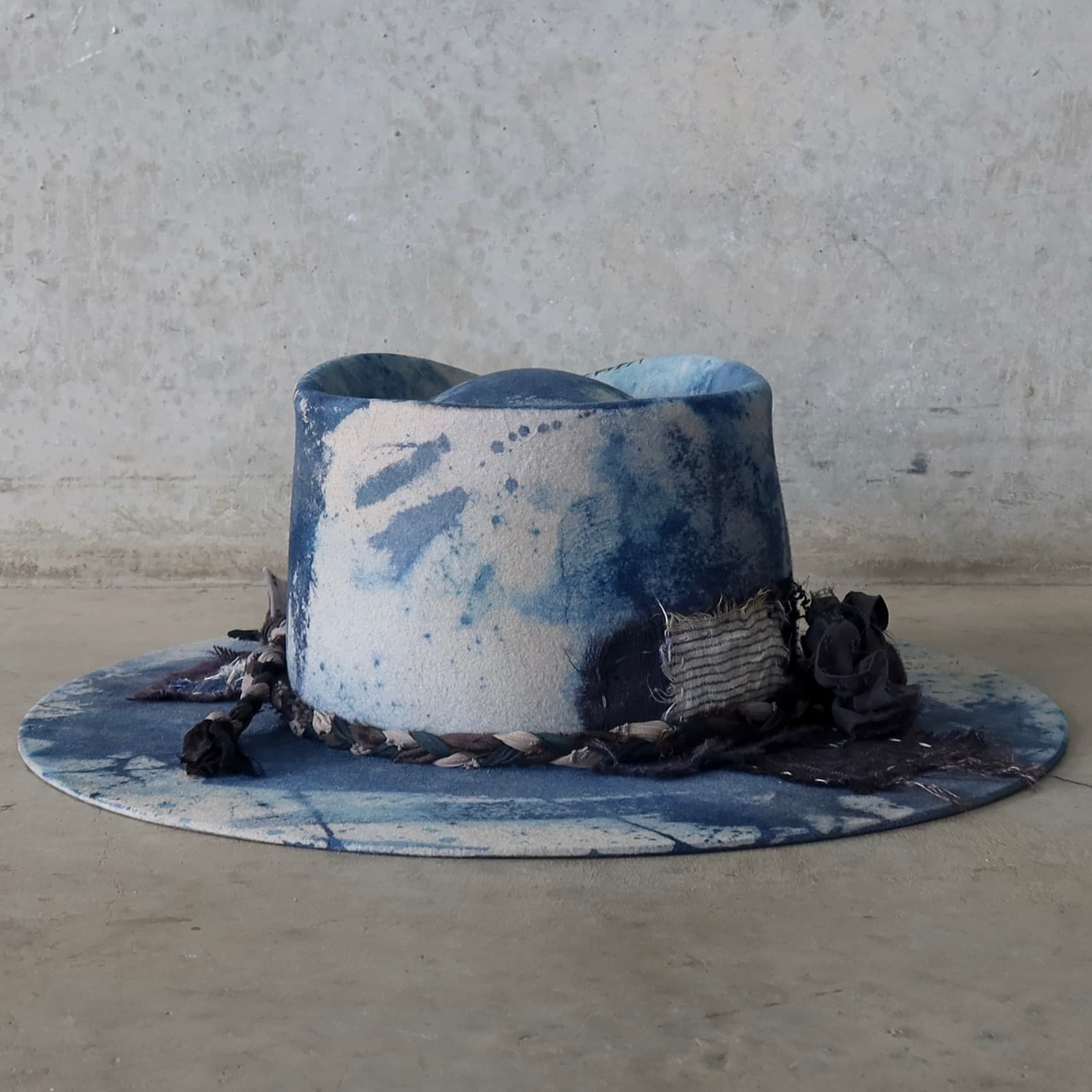 Back view of the dove grey indigo tie dye felt hat Aizome Limited Edition by PHYLLi Designs featuring wabi sabi linen and cotton patchwork.