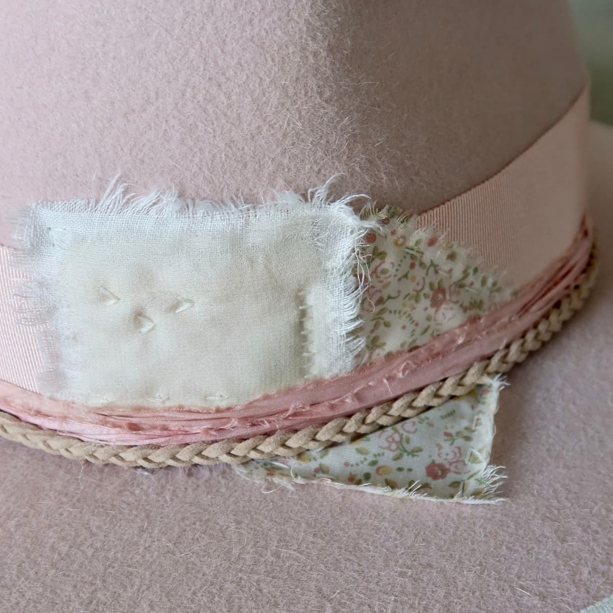 Close up detail of the Argyle Limited Edition felt hat showing wabi sabi patchwork in ivory linen and floral cotton.