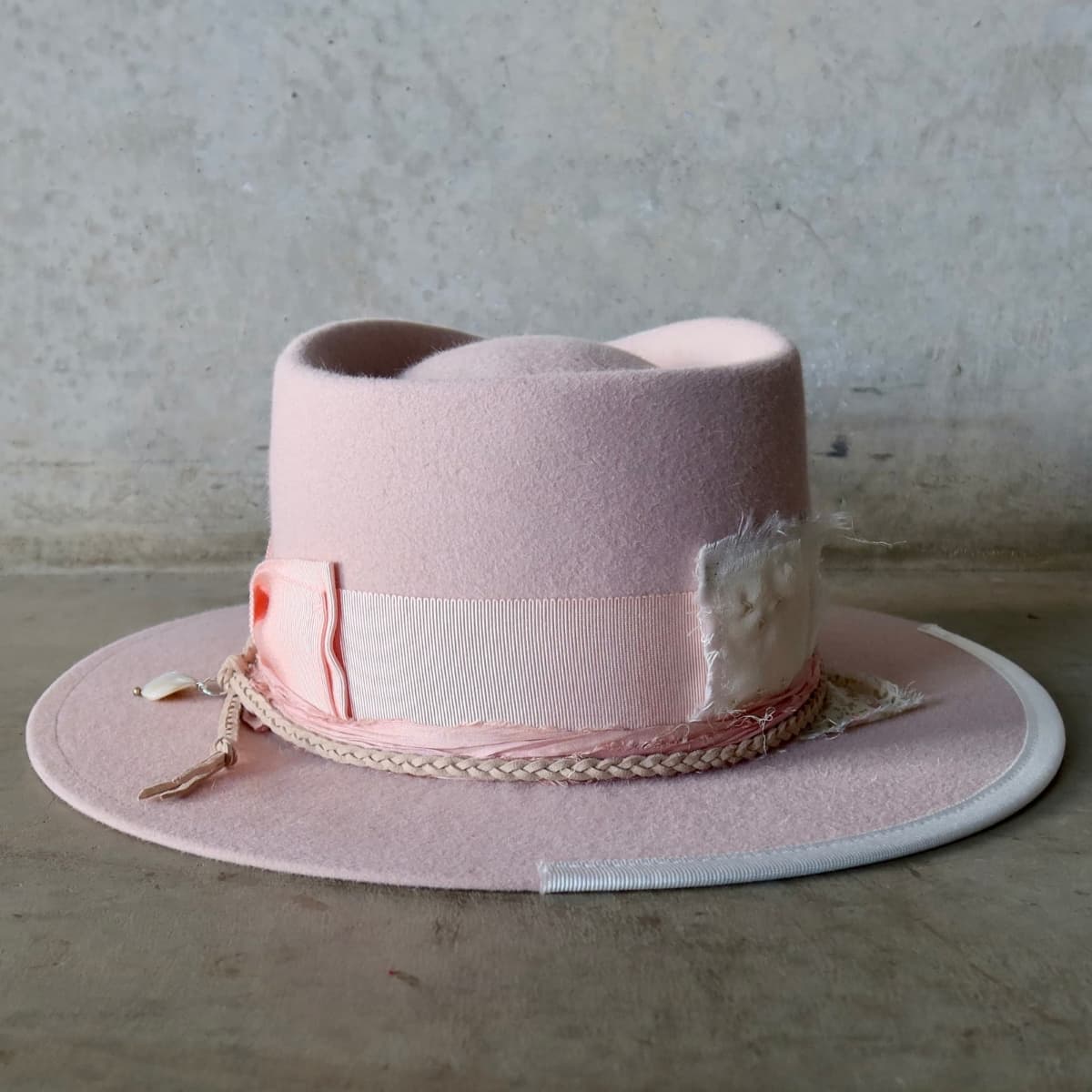 Back view of the baby pink felt hat Argyle Limited Edition by PHYLLi Designs with wabi sabi linen and floral patch trim.