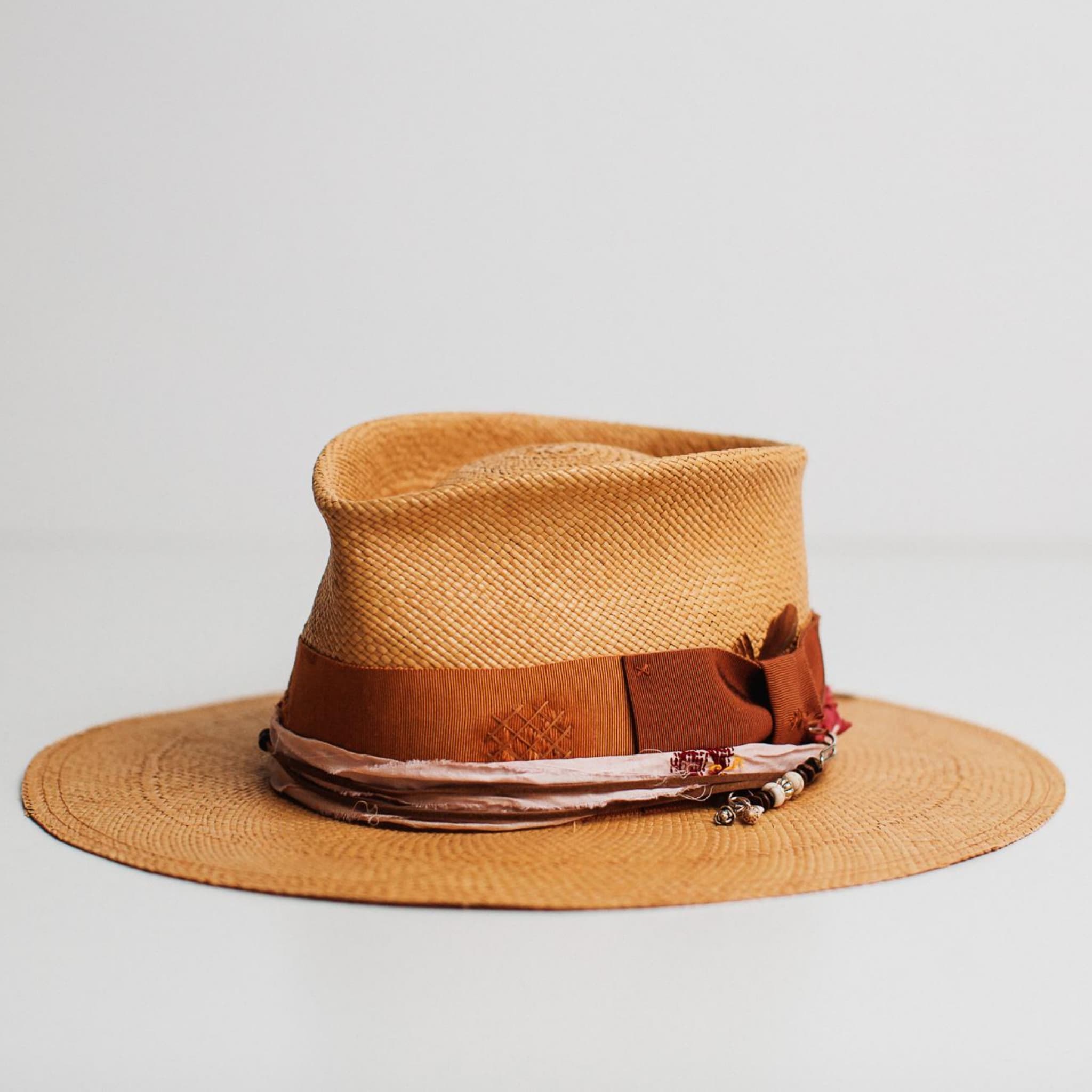 Barbados biscuit Panama hat by PHYLLi Designs with copper band and shell charm hat pin.