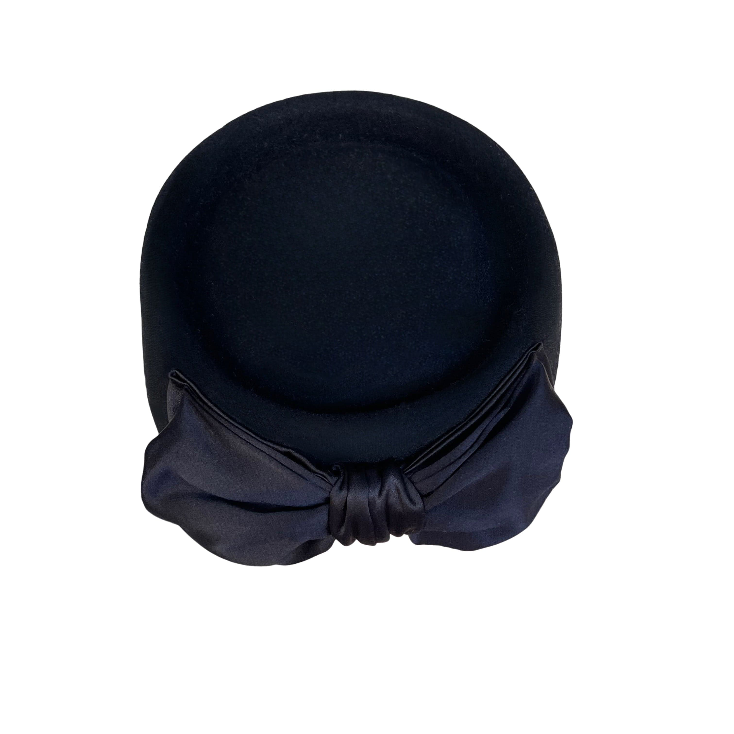 Back view of the black felt pillbox hat Brooke Pillbox by PHYLLi Designs featuring an Italian silk double bow trim.