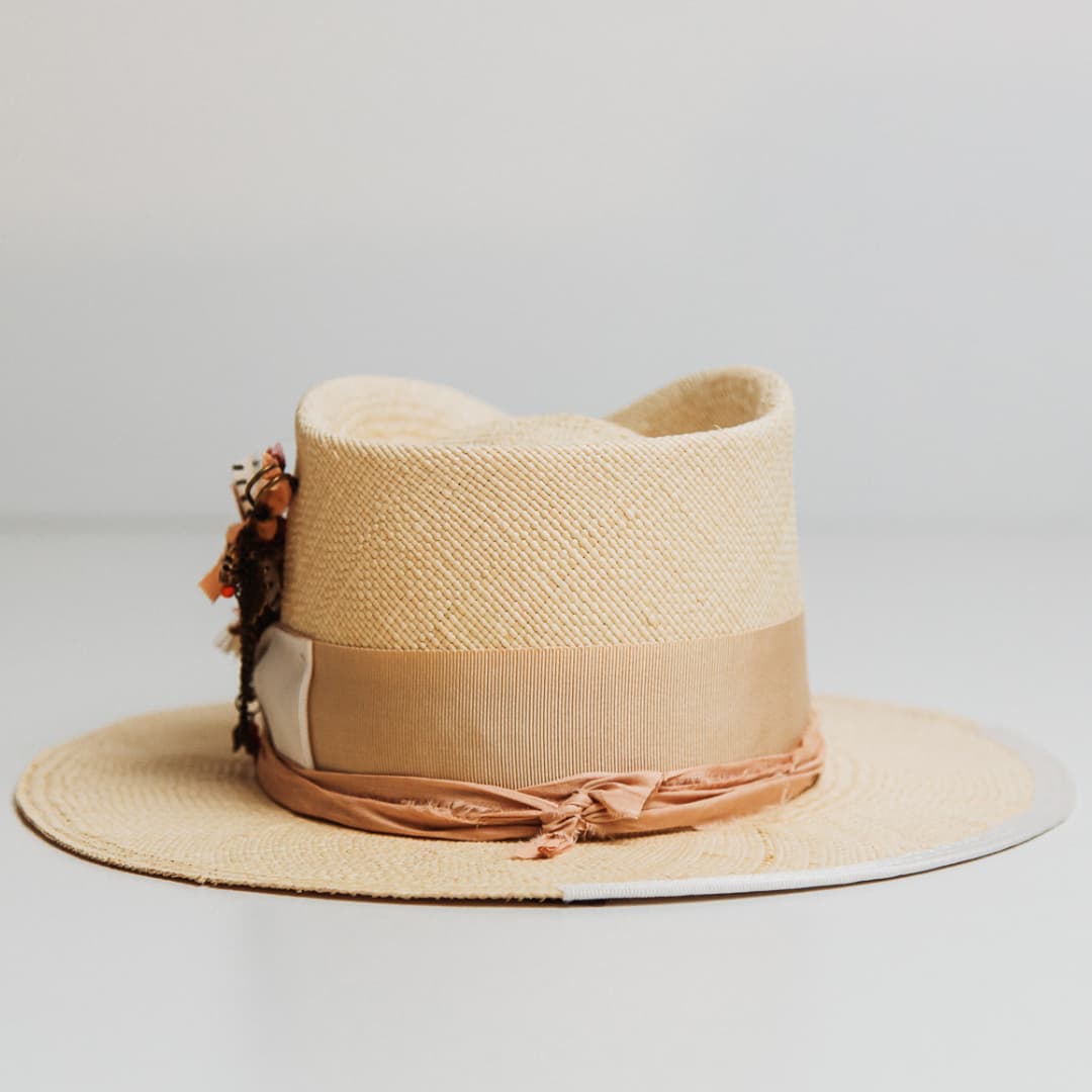 Back view of Calipso Panama hat in Natural toquilla straw with Sand grosgrain band and Melon sari silk trim.