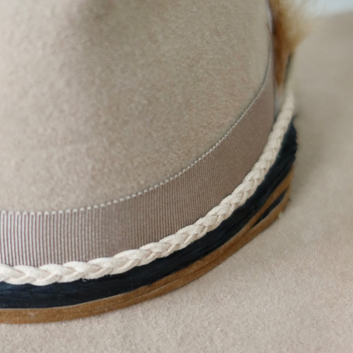 Close up detail of the Casey cowboy hat showing taupe Japanese grosgrain band with braided suede wrap.