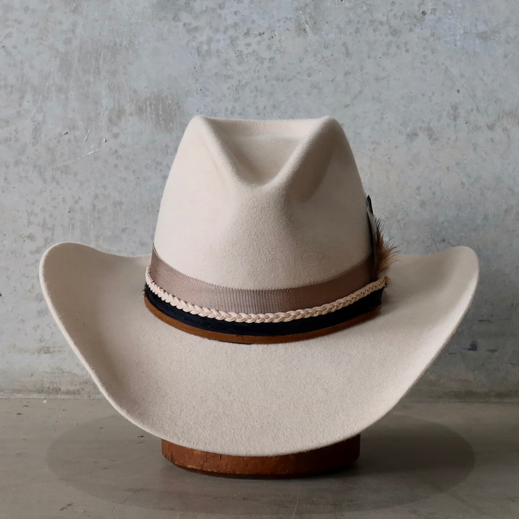 Beige felt cowboy hat Casey Beige by PHYLLi Designs with taupe Japanese grosgrain band, black sari silk trim and plaited nude suede string.