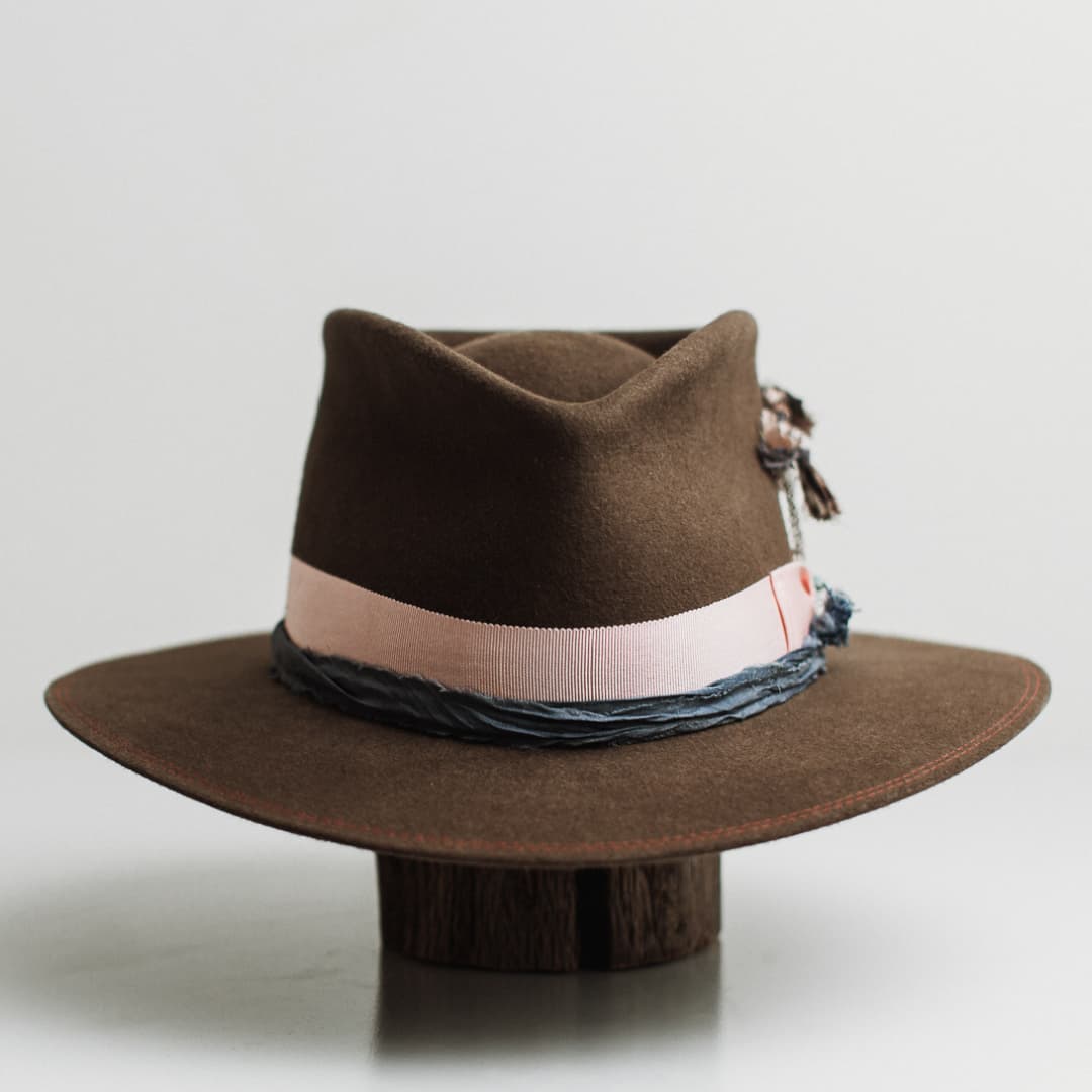Denman dirty olive felt hat by PHYLLi Designs with sherbet pink Japanese grosgrain bow band and silver chunky hat pin with turquoise beading.