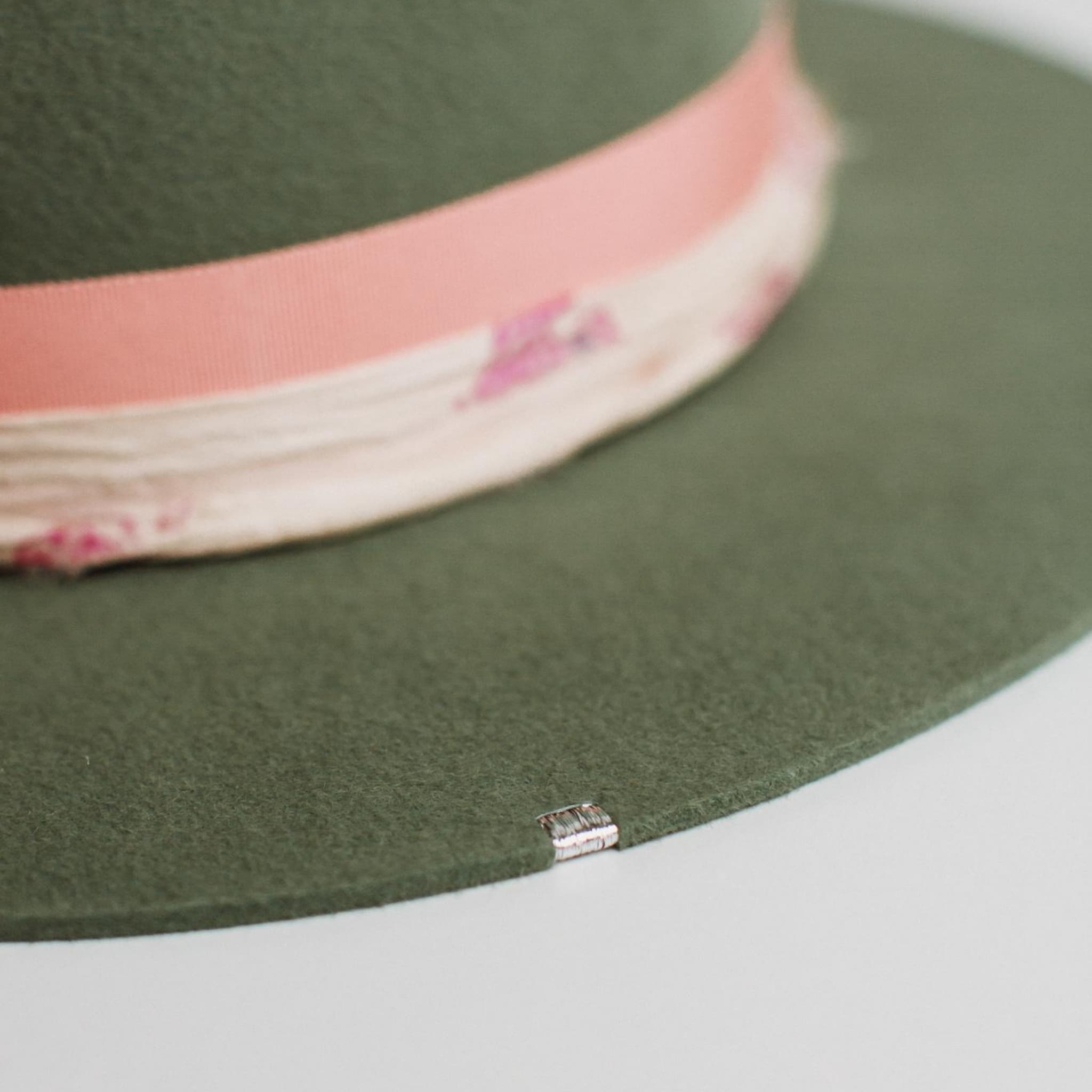 Close up of silver brim tag stitching on the Diamonds & Pearls eucalyptus felt hat by PHYLLi Designs.