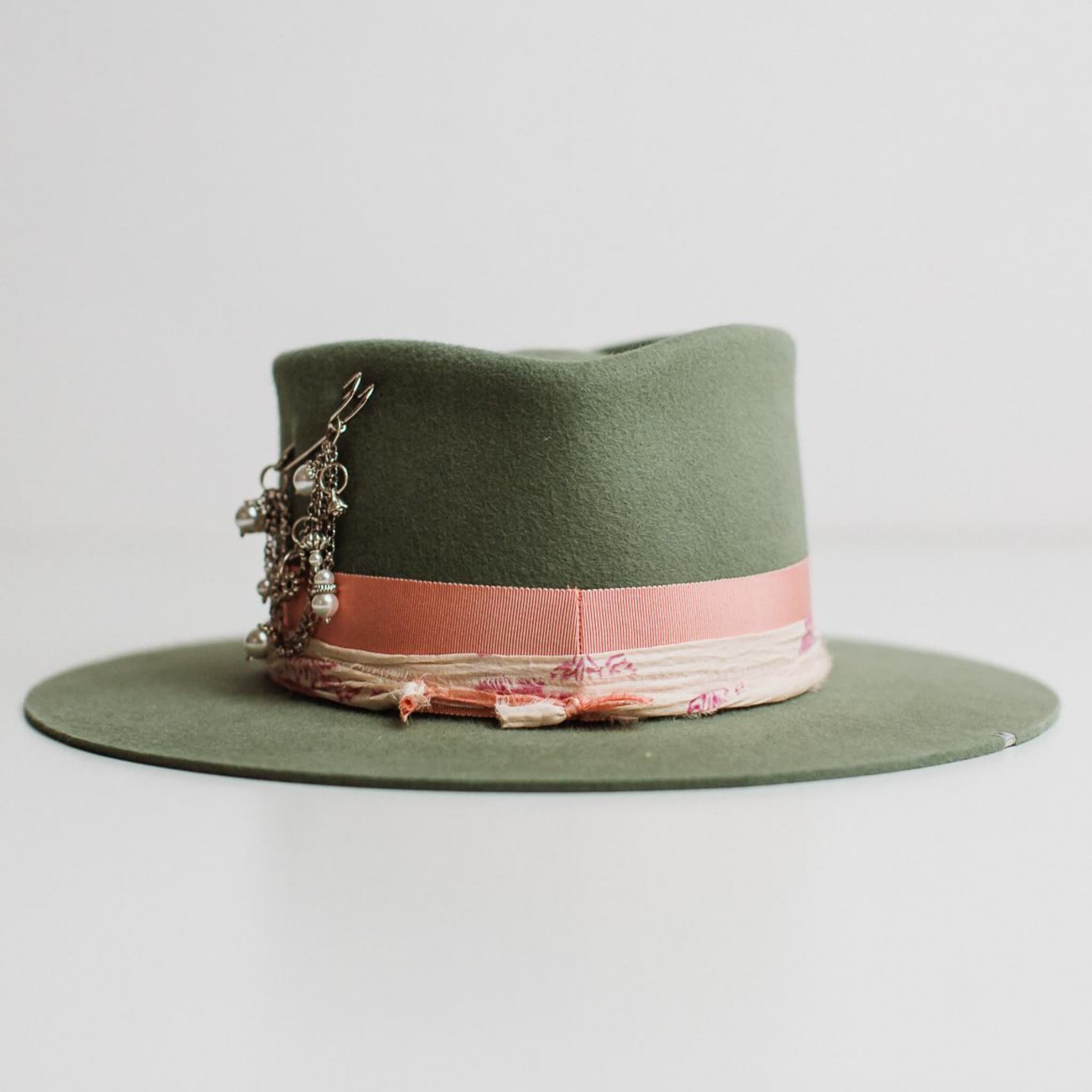Back view of the Diamonds & Pearls eucalyptus felt hat by PHYLLi Designs featuring silver brim tag stitching.