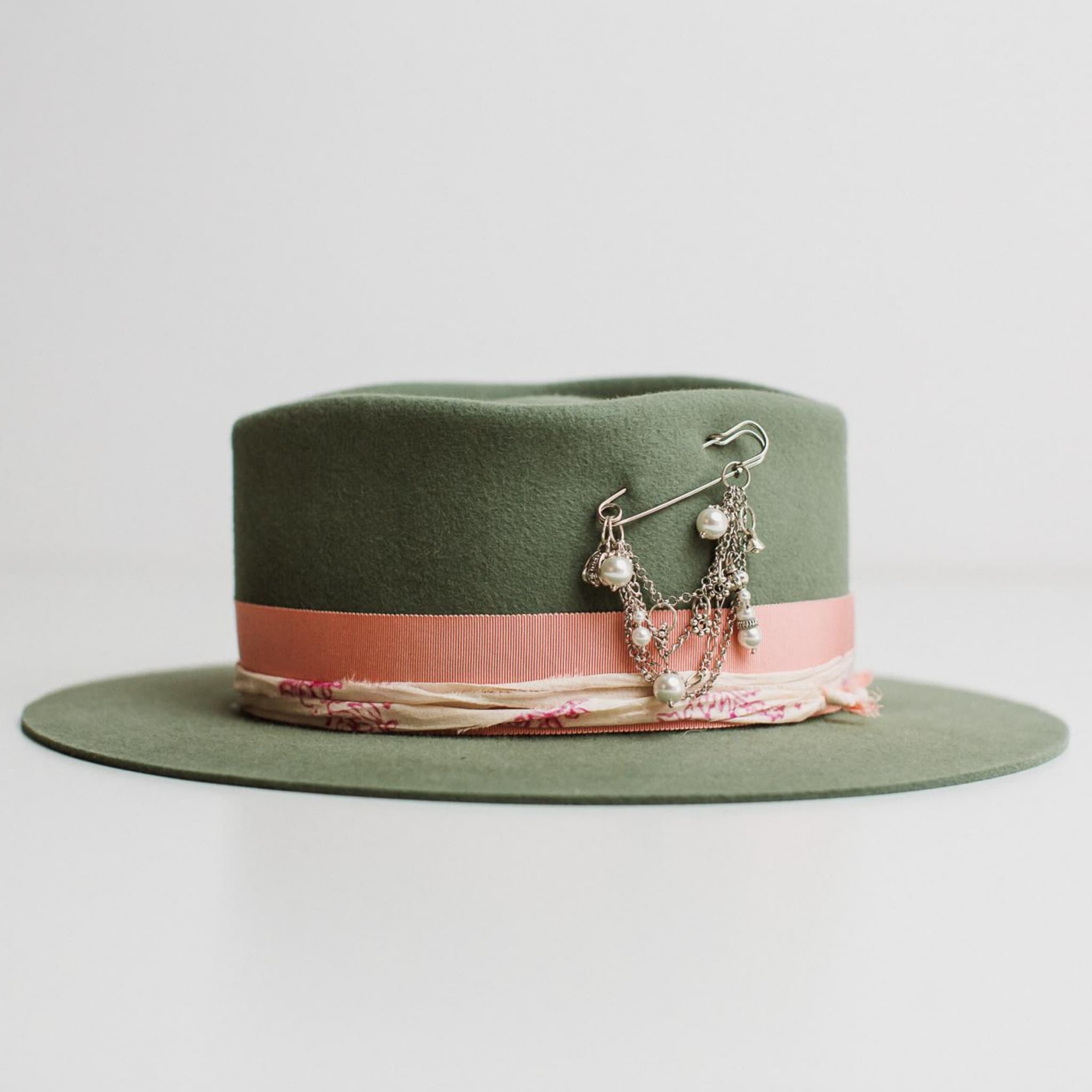 Left side view of the Diamonds & Pearls eucalyptus felt hat by PHYLLi Designs with sherbet pink grosgrain band and pearl charm hat pin.