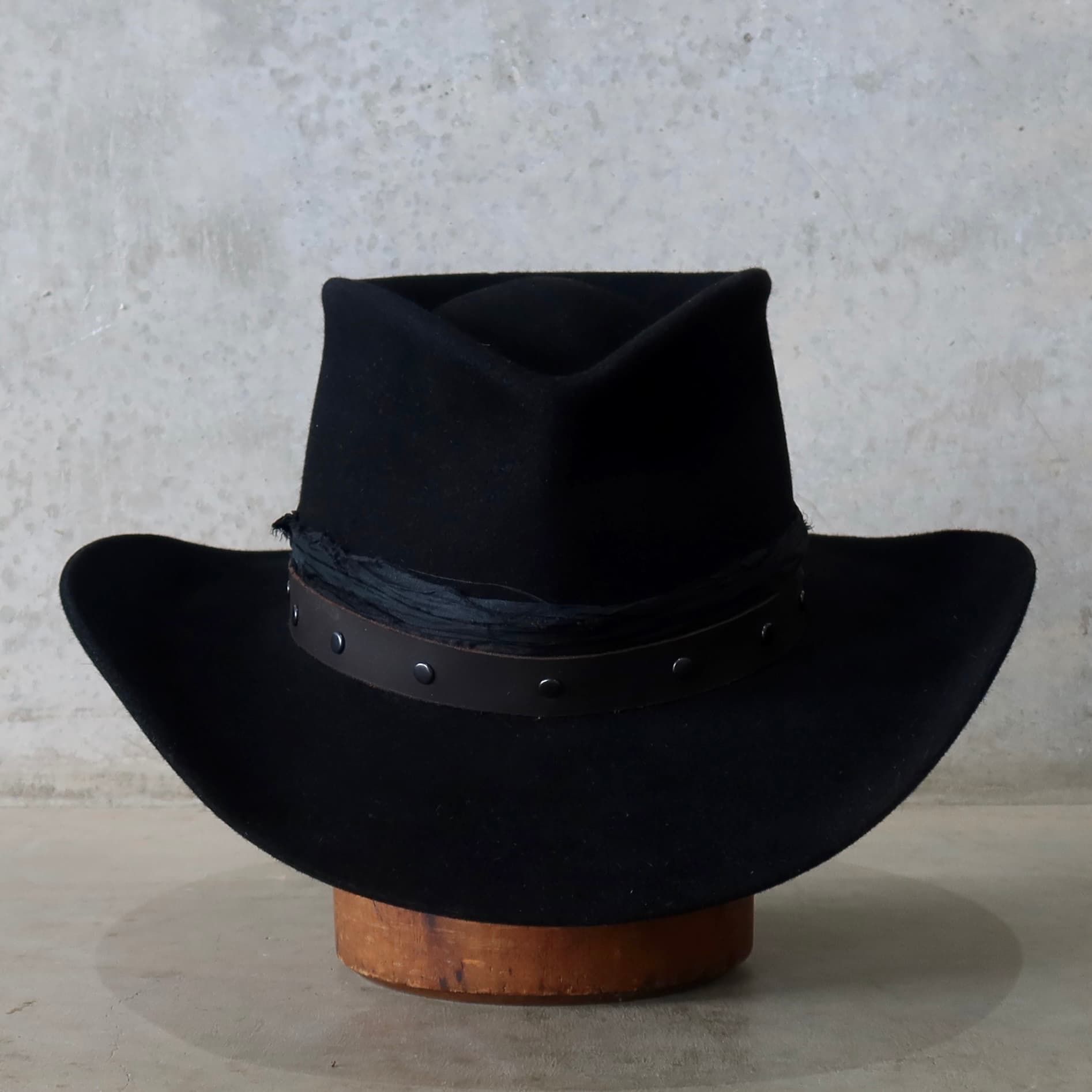 Black felt cowboy hat Edwards by PHYLLi Designs with buffalo leather studded hat band and black sari silk trim.