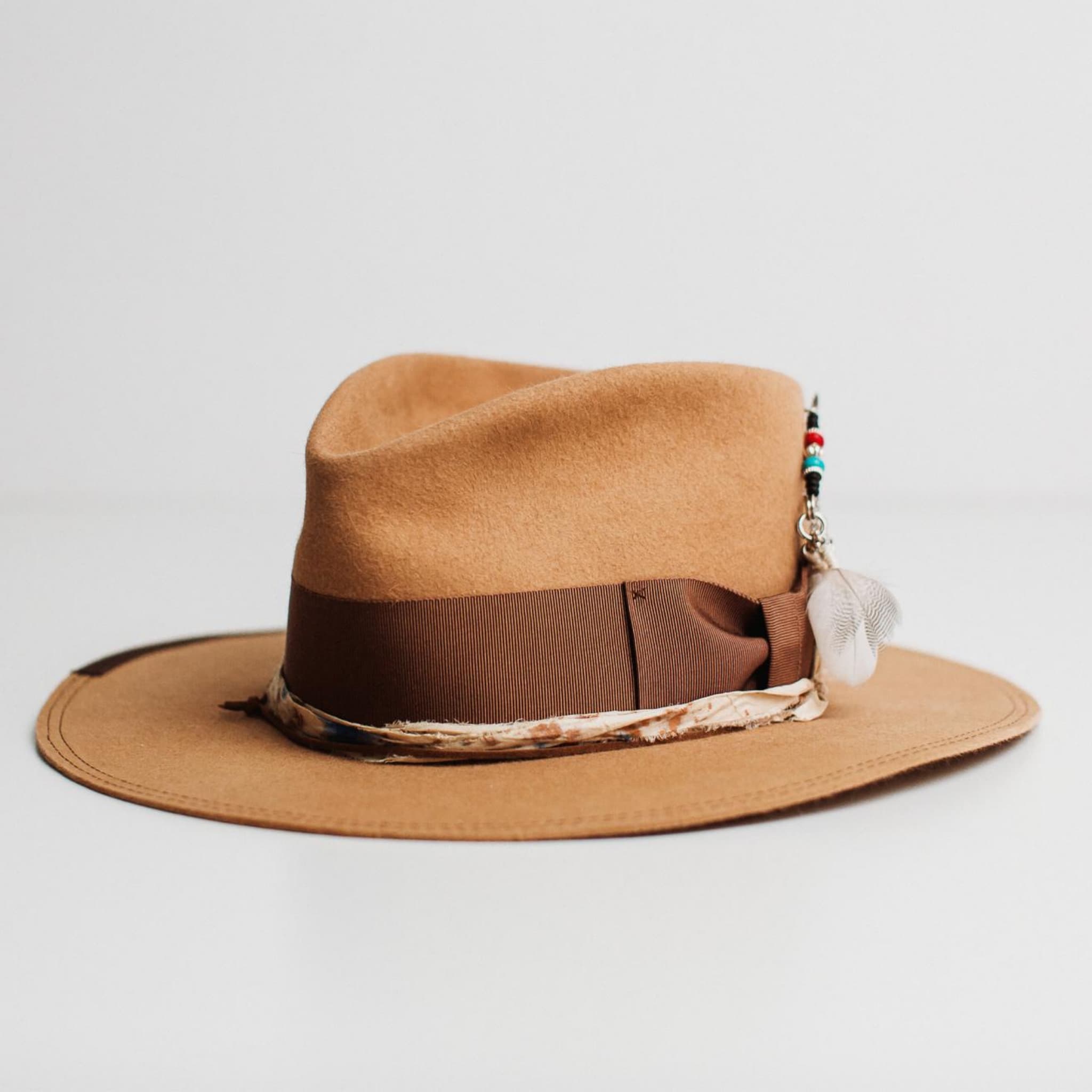 Front left angle of Fly Fisher camel felt hat by PHYLLi Designs featuring chocolate grosgrain band, dark brown double brim stitch and sari silk trim.