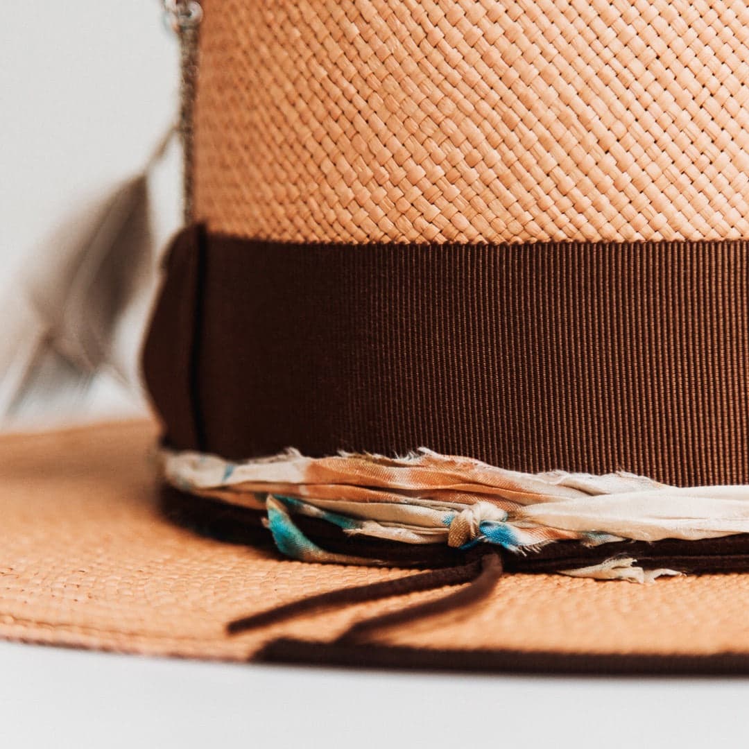 Close up detail of the Fly Fisher Panama hat showing speckled sari silk trimming with chocolate grosgrain band and dark brown brim trim.