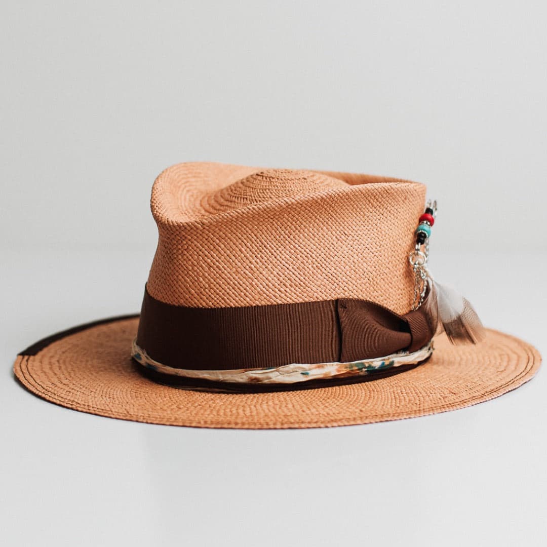 Front left angle of the Fly Fisher Panama biscuit Panama hat by PHYLLi Designs with chocolate grosgrain band and sari silk trim in speckled ivory, blue and rust.