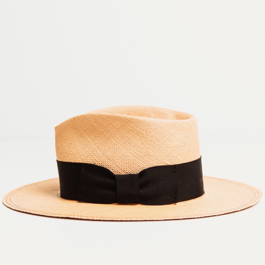 Side view of Holiday Biscuit Panama hat with Black grosgrain bow band.