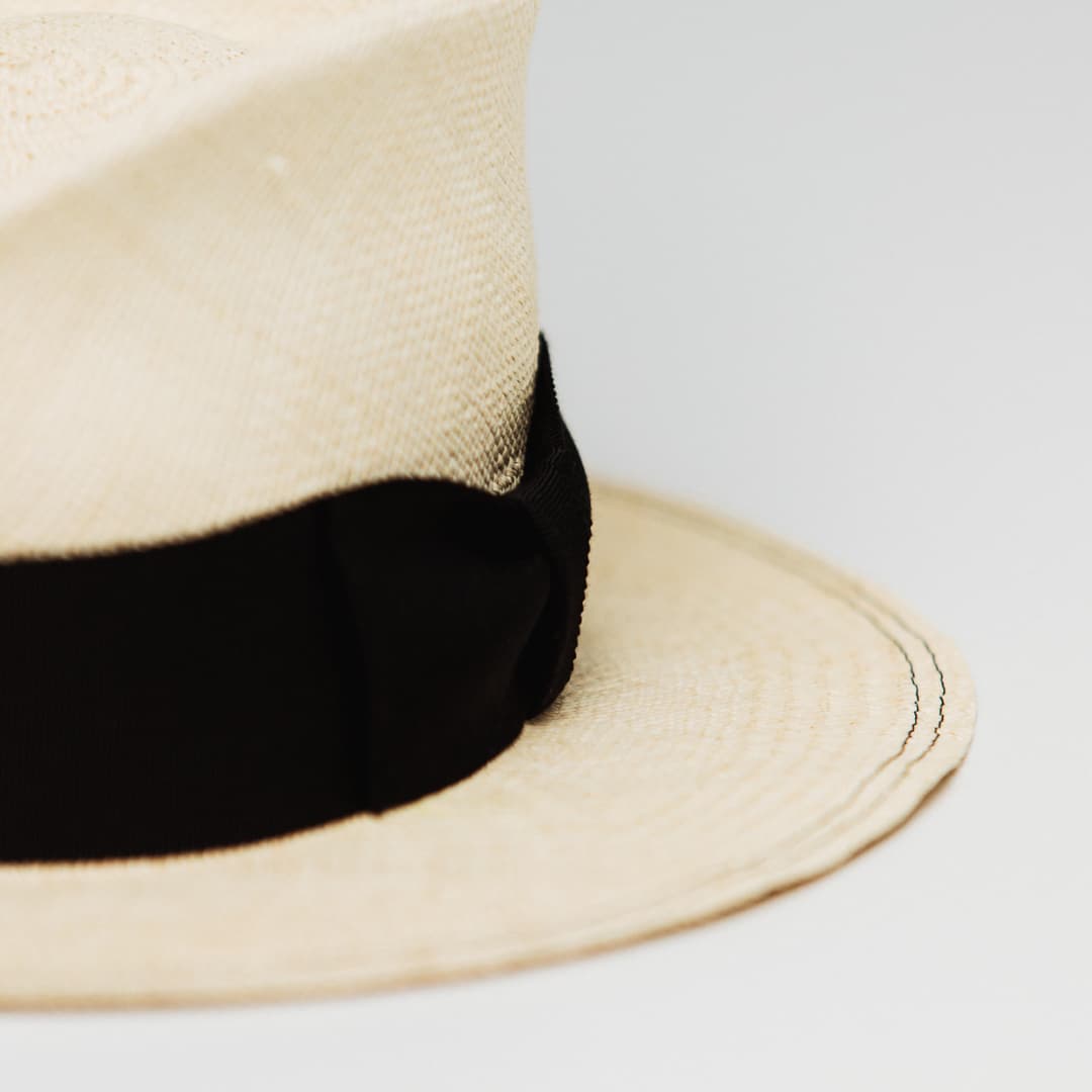Close up detail of Holiday Natural premium Panama hat showing Black double brim stitch.