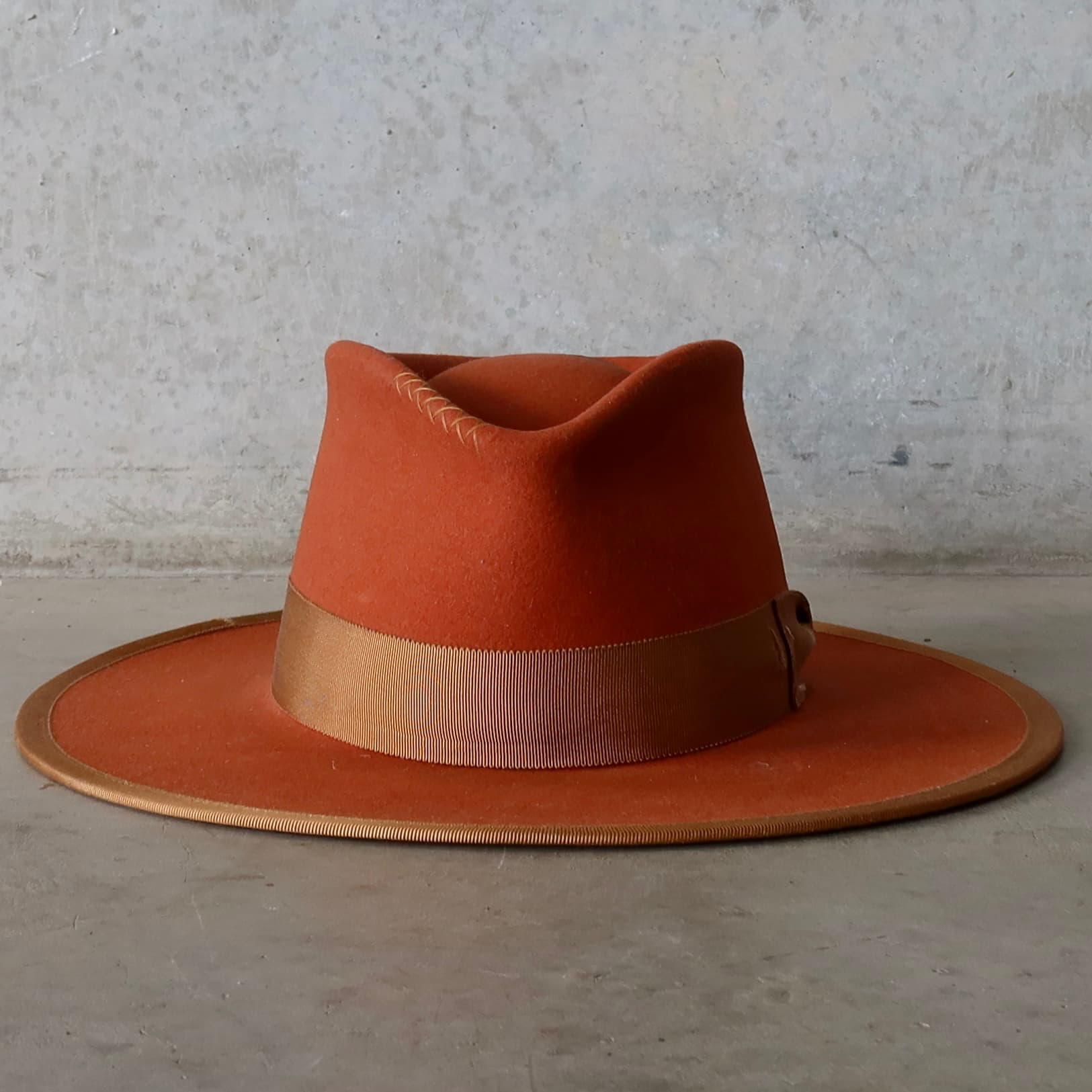 Karratha Spiced Pumpkin distressed felt hat by PHYLLi Designs with distressed copper Japanese grosgrain bow band.