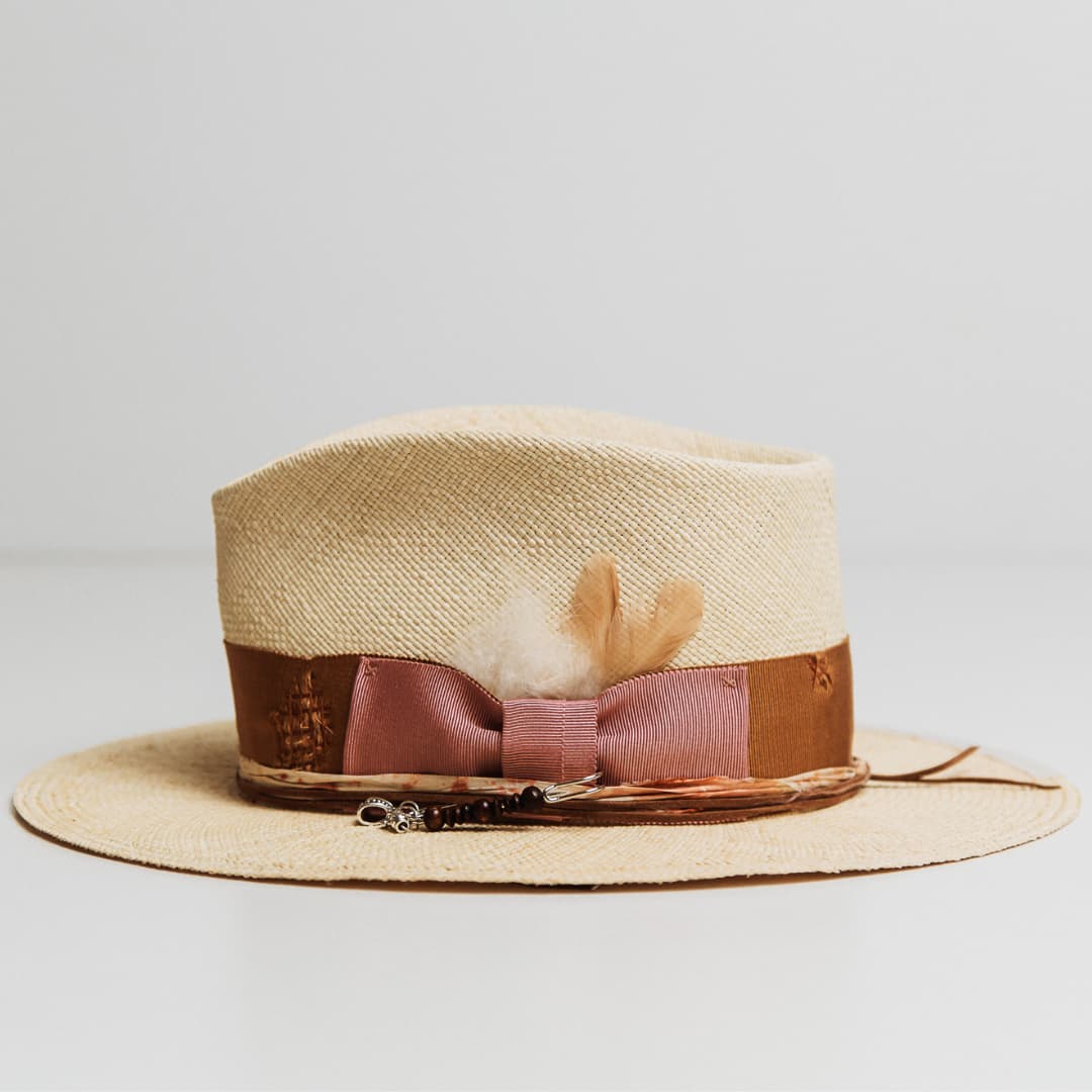Side view of Malibu Panama hat with distressed Copper grosgrain band and sari silk trim.