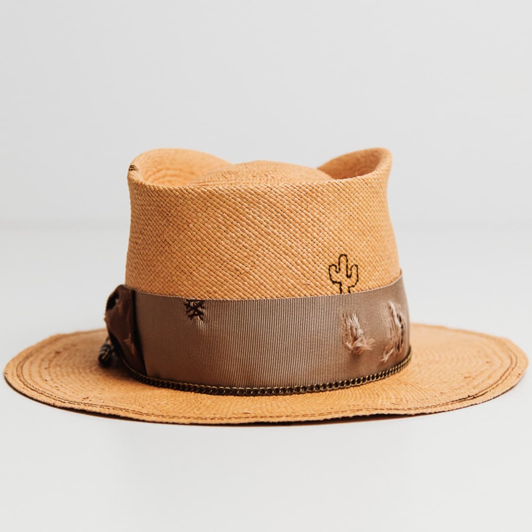Back view of Normie Panama hat featuring burnt branded cactus and distressed band.