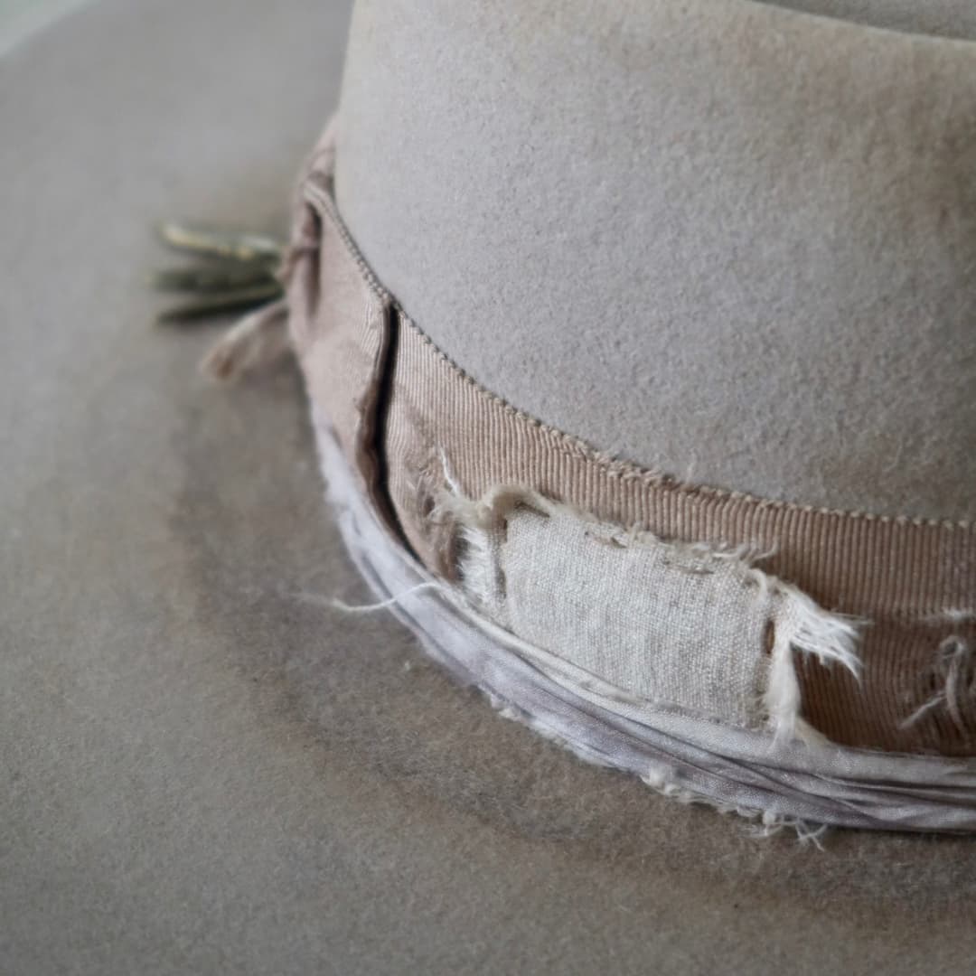 Close up detail of the Oakley Limited Edition felt hat showing layered linen and cotton patchwork.