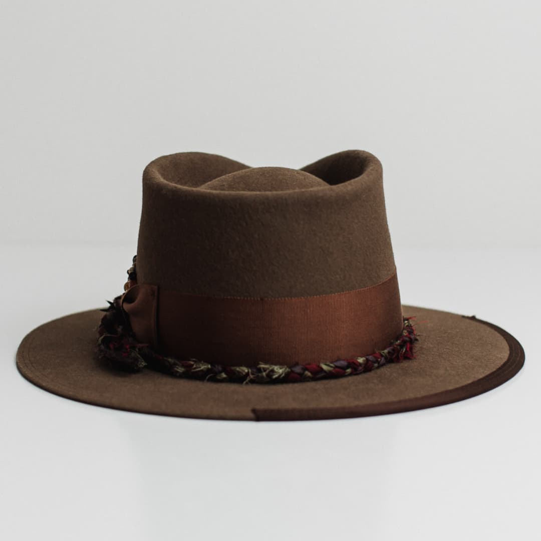 Back view of the Olive Enchanted dirty olive felt hat by PHYLLi Designs featuring double brim stitch in dark brown and dark brown grosgrain brim trim.