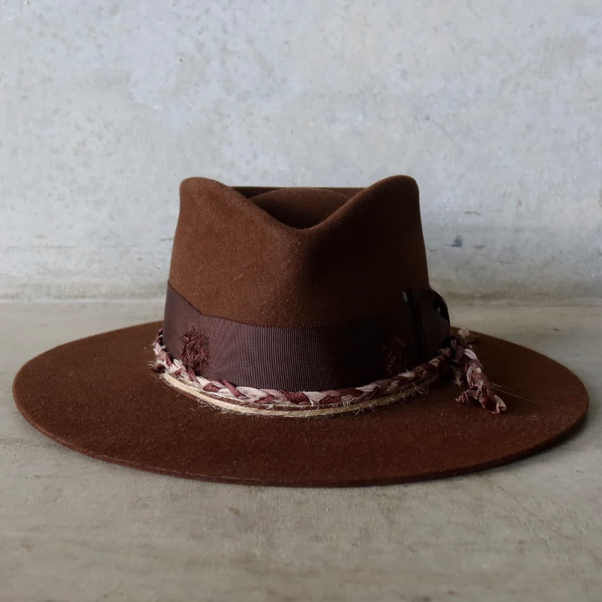 Chocolate felt hat Palmer Limited Edition by PHYLLi Designs with distressed dark brown Japanese grosgrain double bow band and plaited sari silk trim.