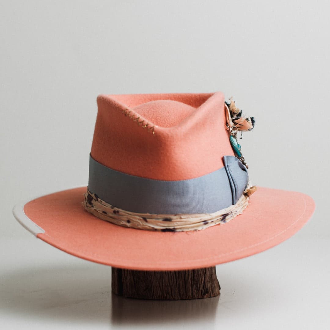 Pāua peach felt hat by PHYLLi Designs with cornflower Japanese grosgrain double bow band and chunky silver charm hat pin.