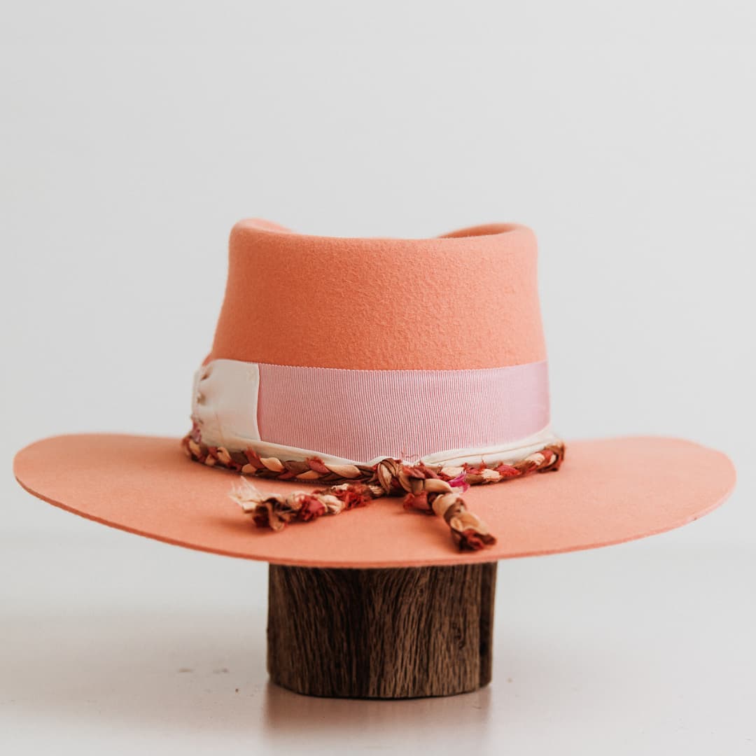 Back view of The Peach felt hat by PHYLLi Designs with floss pink Japanese grosgrain band and sari silk trim.