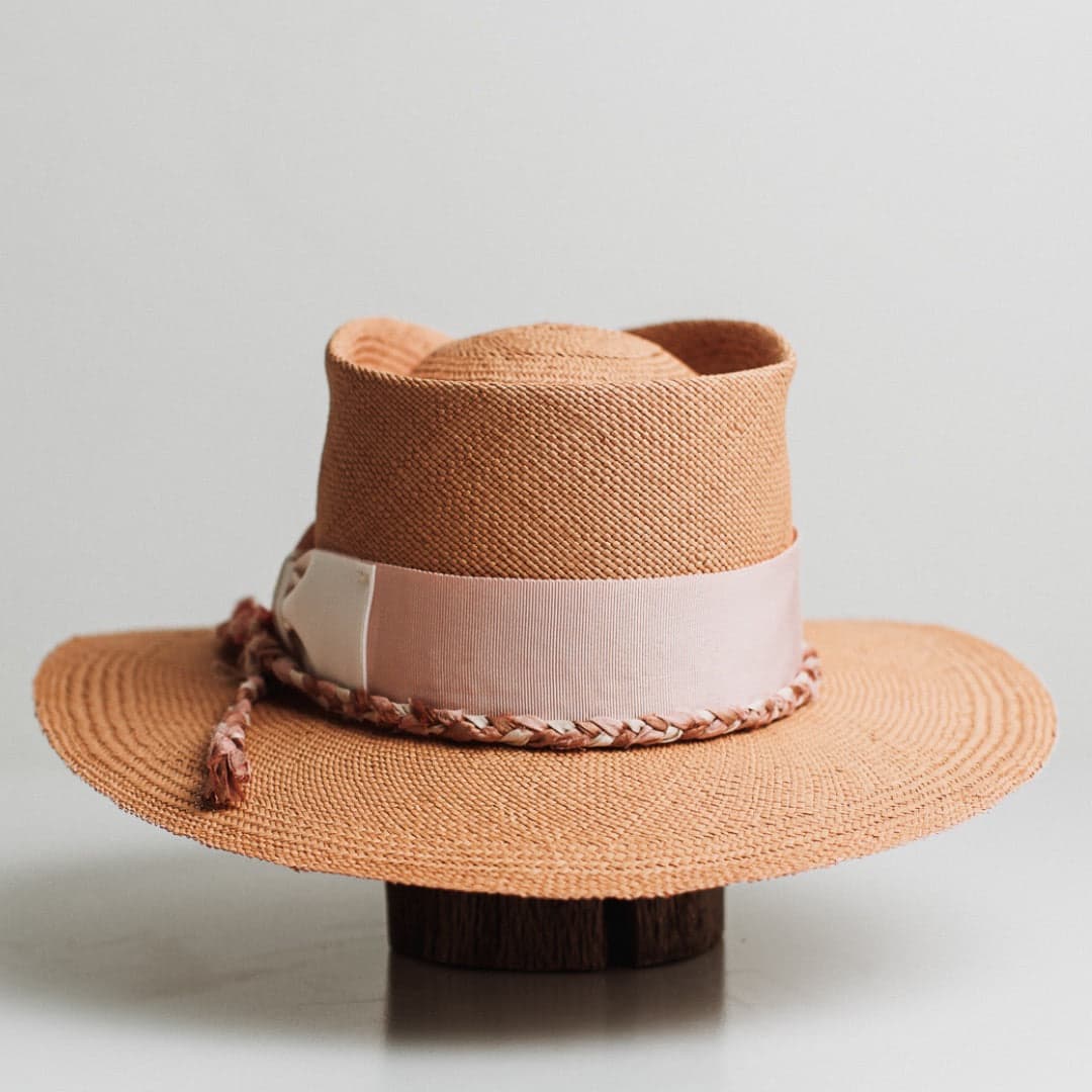 Back view of the Peach Panama biscuit Panama hat by PHYLLi Designs featuring plaited sari silk trimming in pink, bronze and ivory.