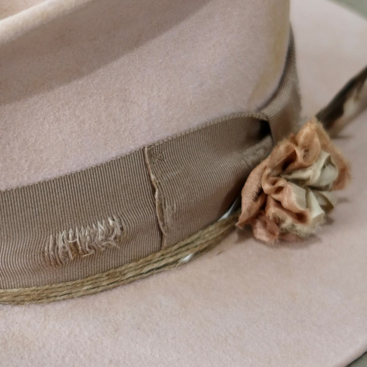 Close up detail of the Pink Bloom felt hat showing distressed taupe Japanese grosgrain bow band.