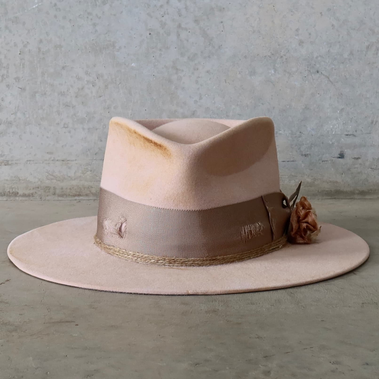Baby pink distressed felt hat Pink Bloom by PHYLLi Designs with distressed taupe Japanese grosgrain double bow band and lapel bloom.