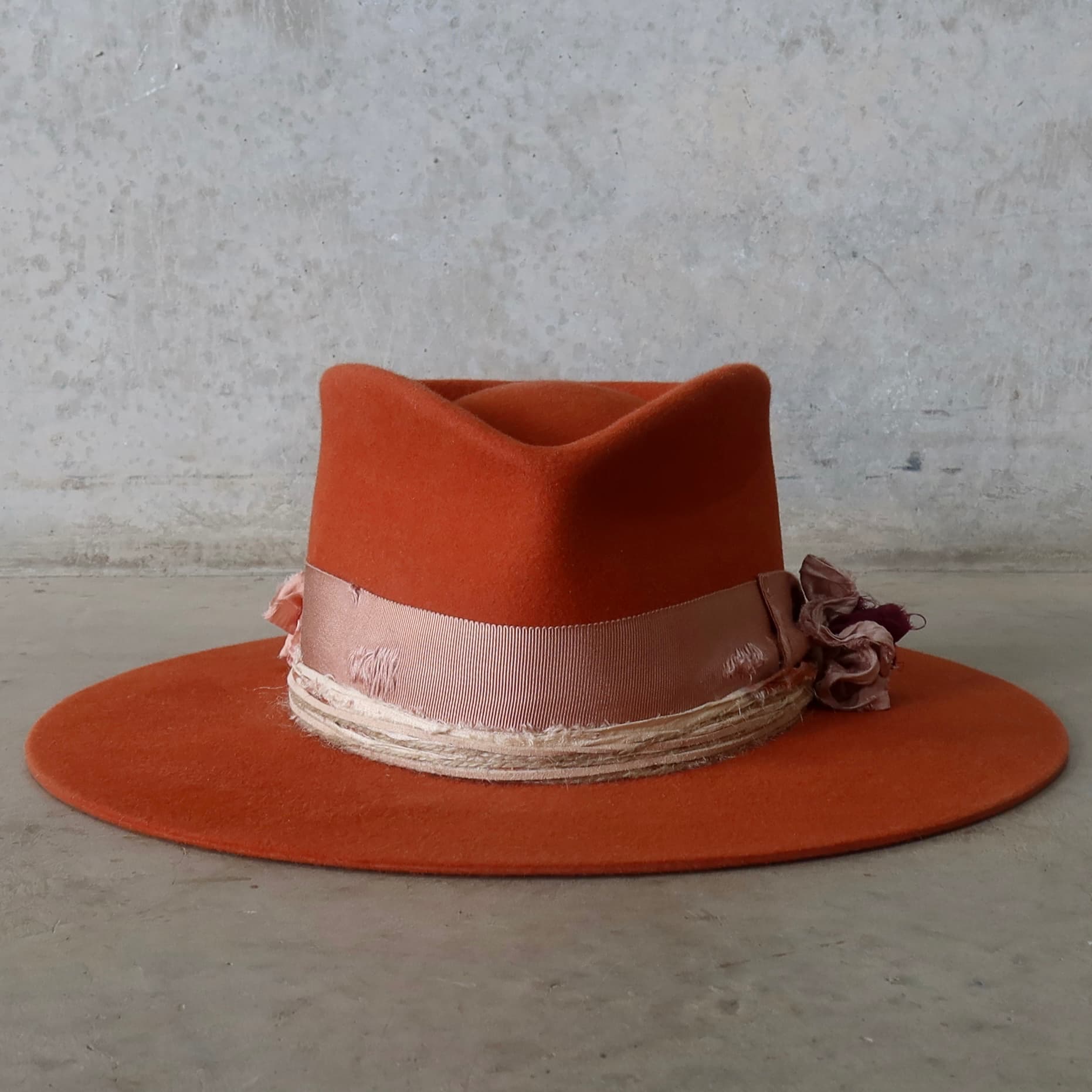 Spiced pumpkin felt hat Pumpkin Bloom by PHYLLi Designs with distressed dirty rose Japanese grosgrain bow band and sari silk lapel bloom.