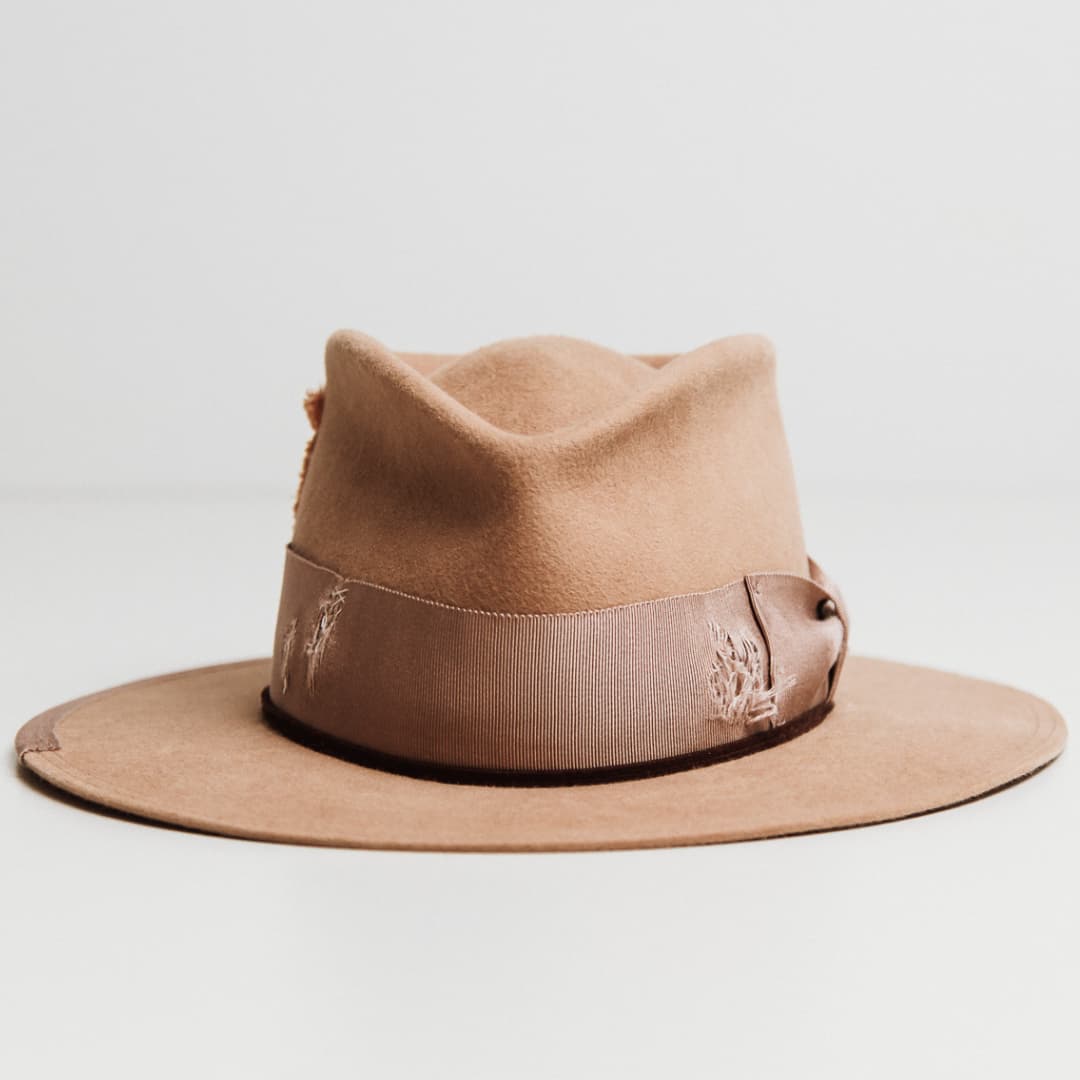 Reiko camel felt hat by PHYLLi Designs with distressed plaster Japanese grosgrain bow band and pink linen cross patterned patch.