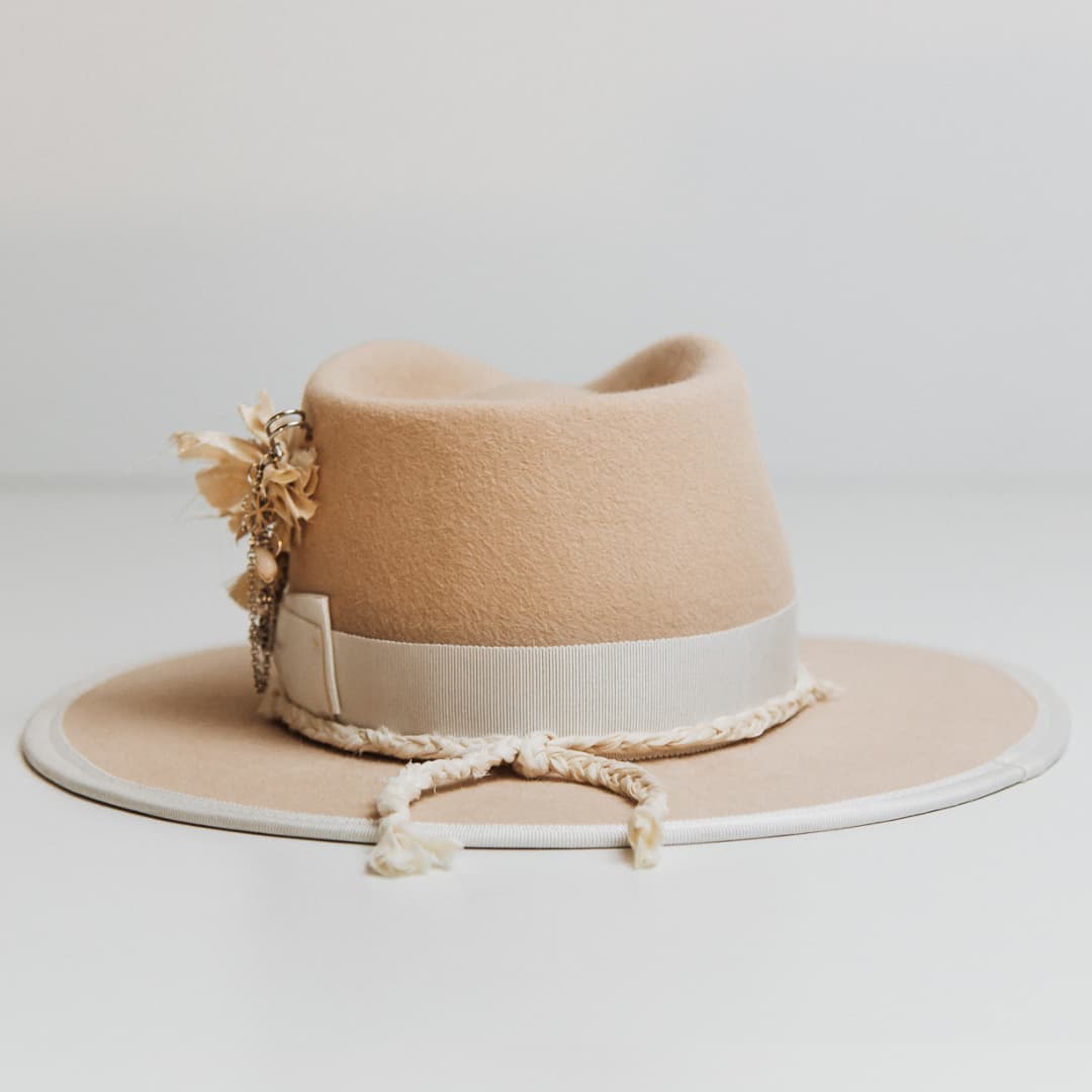 Back view of the Rue De Seine beige felt hat by PHYLLi Designs featuring ivory plaited sari silk brim trim and ivory grosgrain bow band.