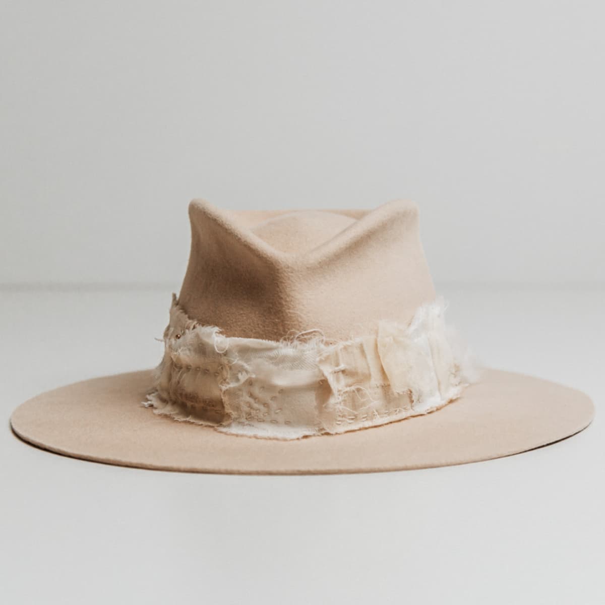 Sabi Limited Edition Beige felt hat by PHYLLi Designs with Wabi Sabi patch band in linen, cotton, organza and georgette silk.
