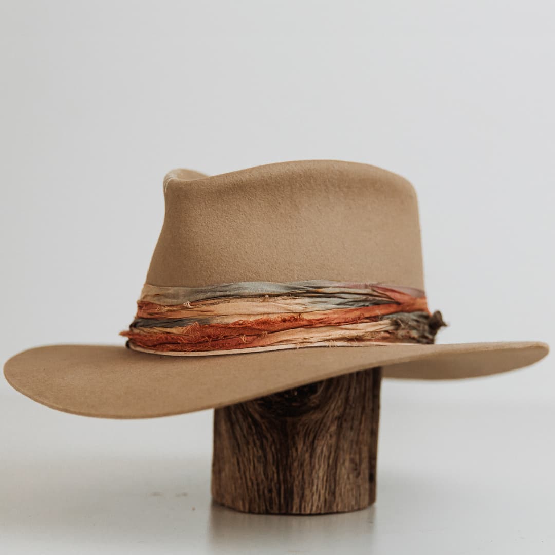 Front left angle of Santa Fe Autumn premium felt hat in Sahara with mushroom Japanese grosgrain band and layered sari silk trimmings.