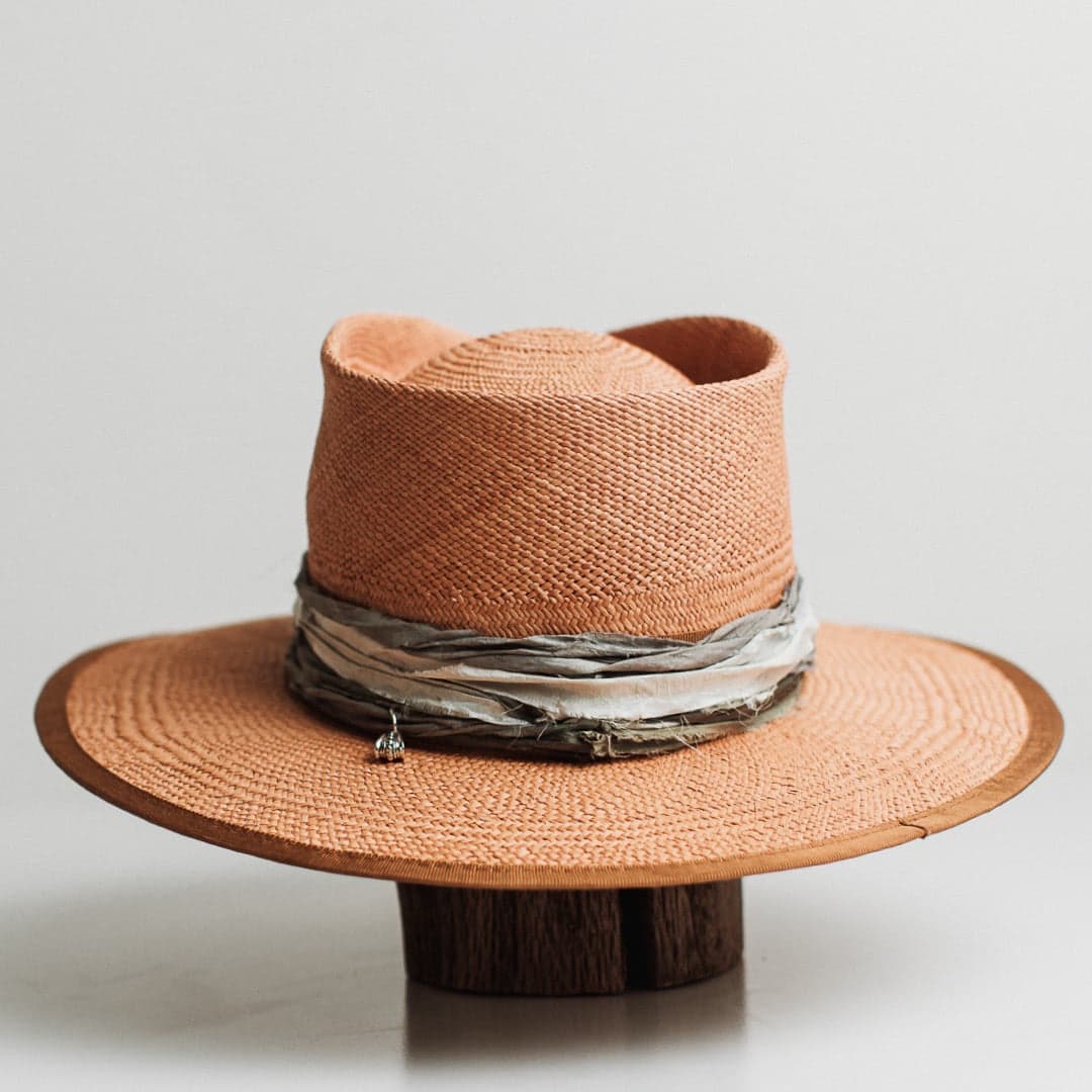 Back view of the Santa Fe Winter Panama biscuit Panama hat by PHYLLi Designs featuring layered sari silk trimming in teal, storm blue and smoke.
