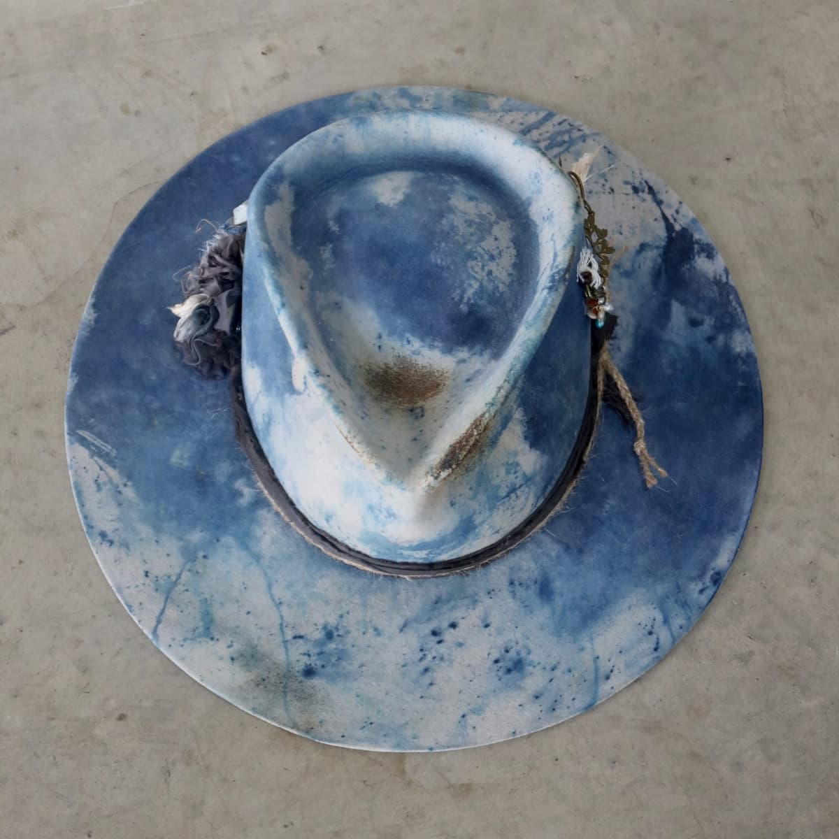 Top down front view of the dove grey indigo tie dye felt hat Shibori Limited Edition by PHYLLi Designs.