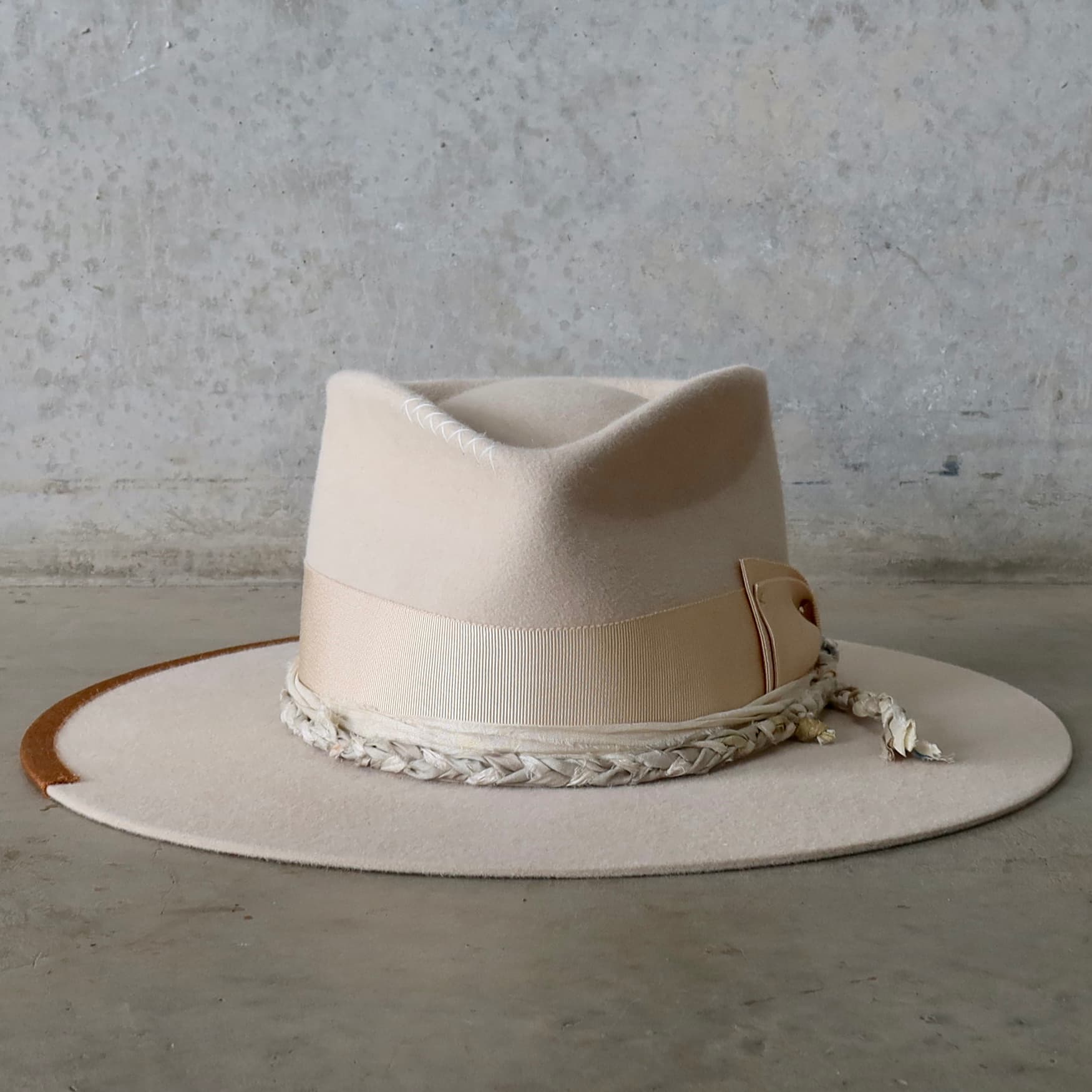 Beige felt hat Shoalhaven by PHYLLi Designs with sand Japanese grosgrain double bow band and plaited sari silk trim.