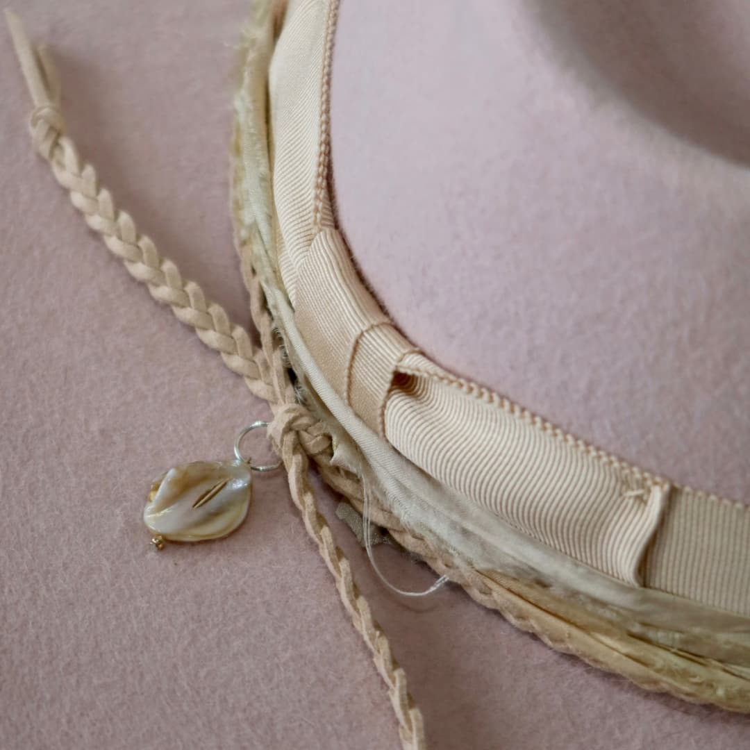Close up detail of the Sorbet felt hat showing sorbet tie dye sari silk trim.