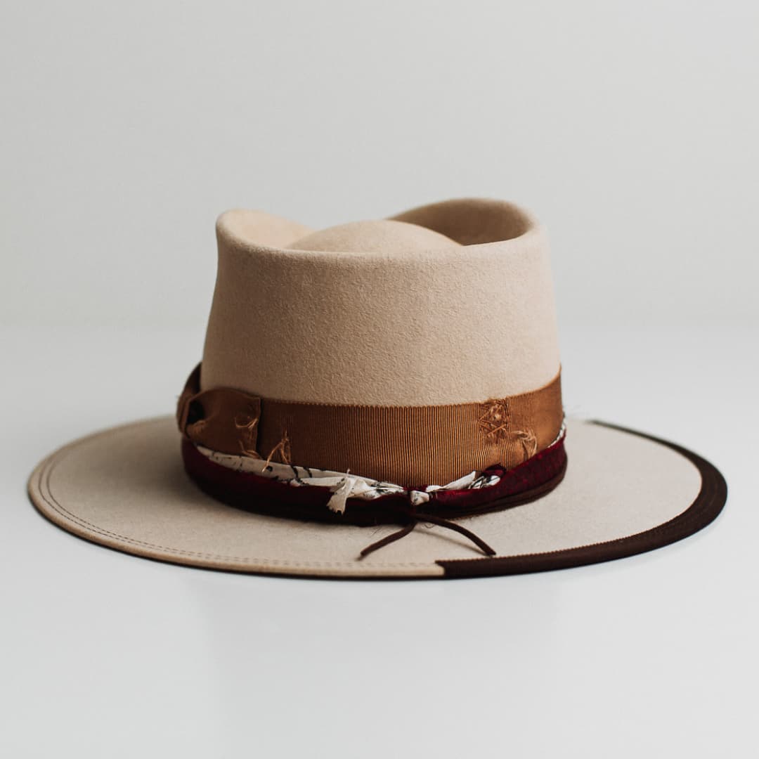 Back view of the Spice Alley beige felt hat by PHYLLi Designs featuring crimson red sari silk trimming and chocolate suede string.