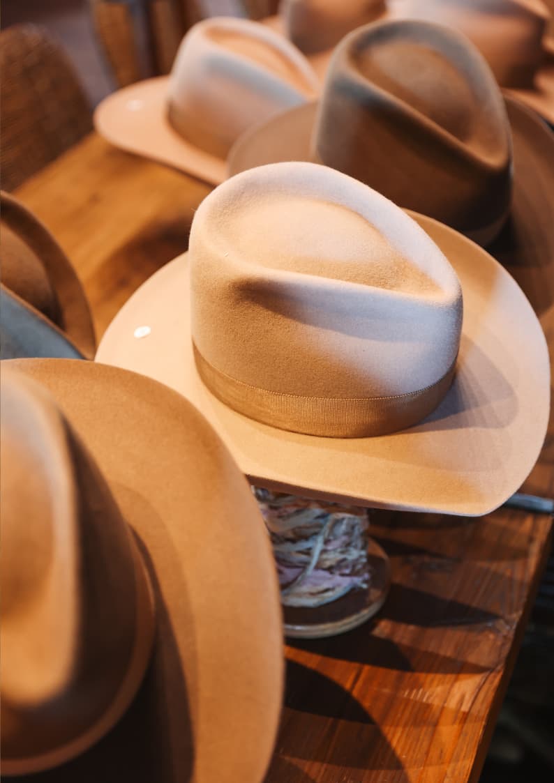 Close up detail of the TCMF Wheeler western felt hat by PHYLLi Designs showing taupe grosgrain band and shaped crown.