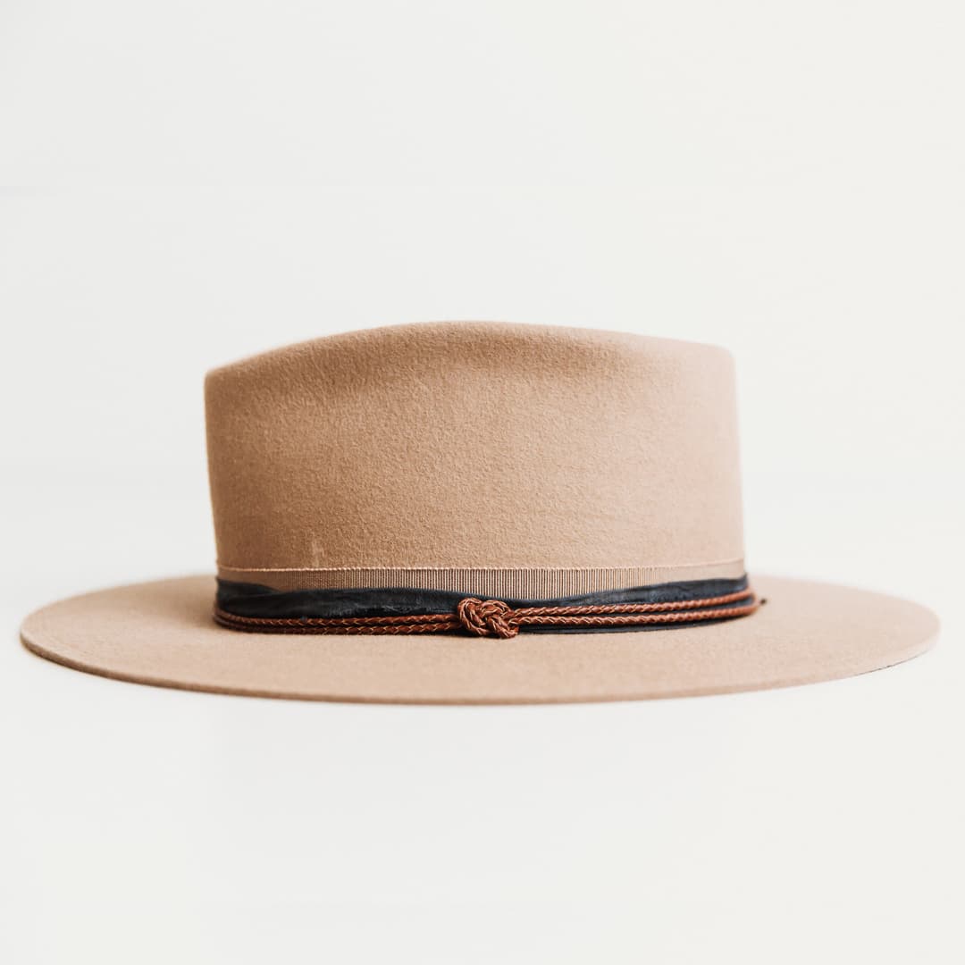 Left side view of The Arkle Sahara felt hat by PHYLLi Designs with navy sari silk trim and leather Laurie band.