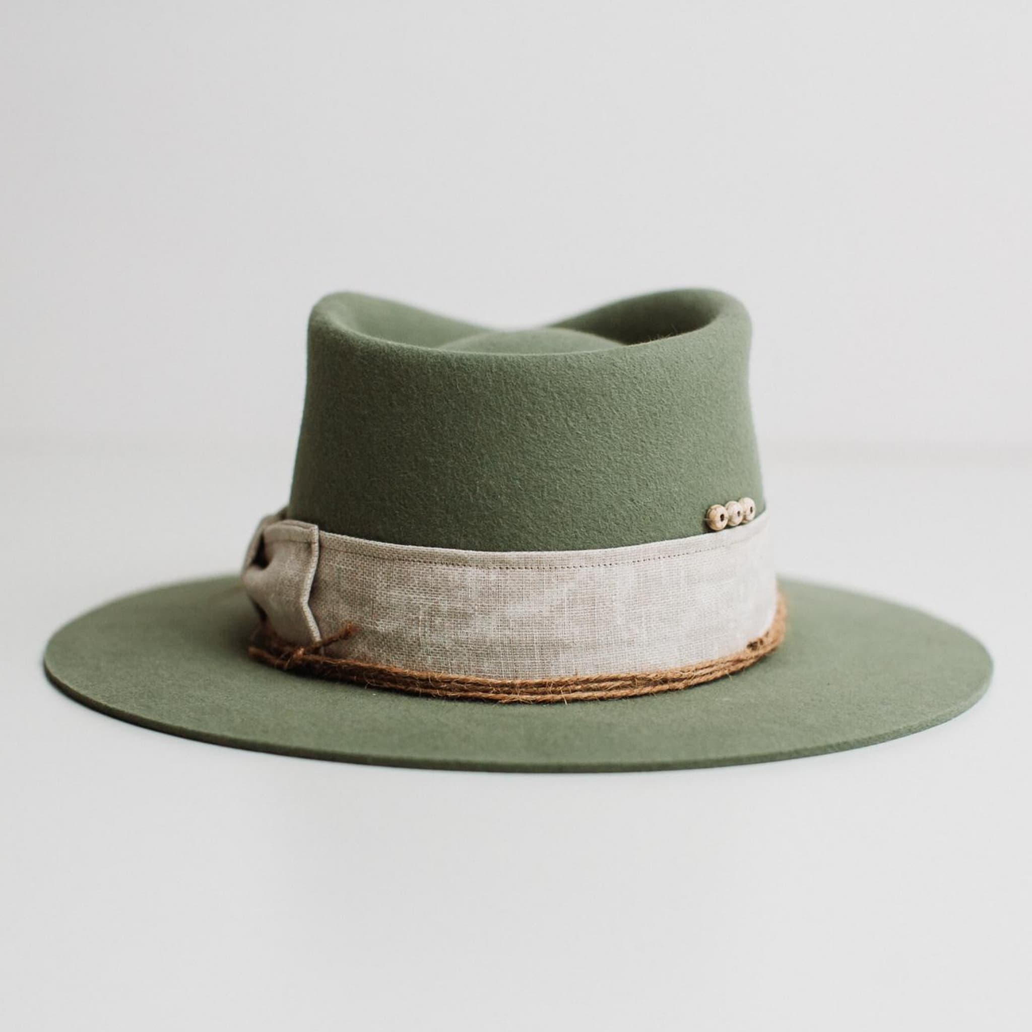 Back view of The Fall eucalyptus felt hat by PHYLLi Designs with ivory beading detail.
