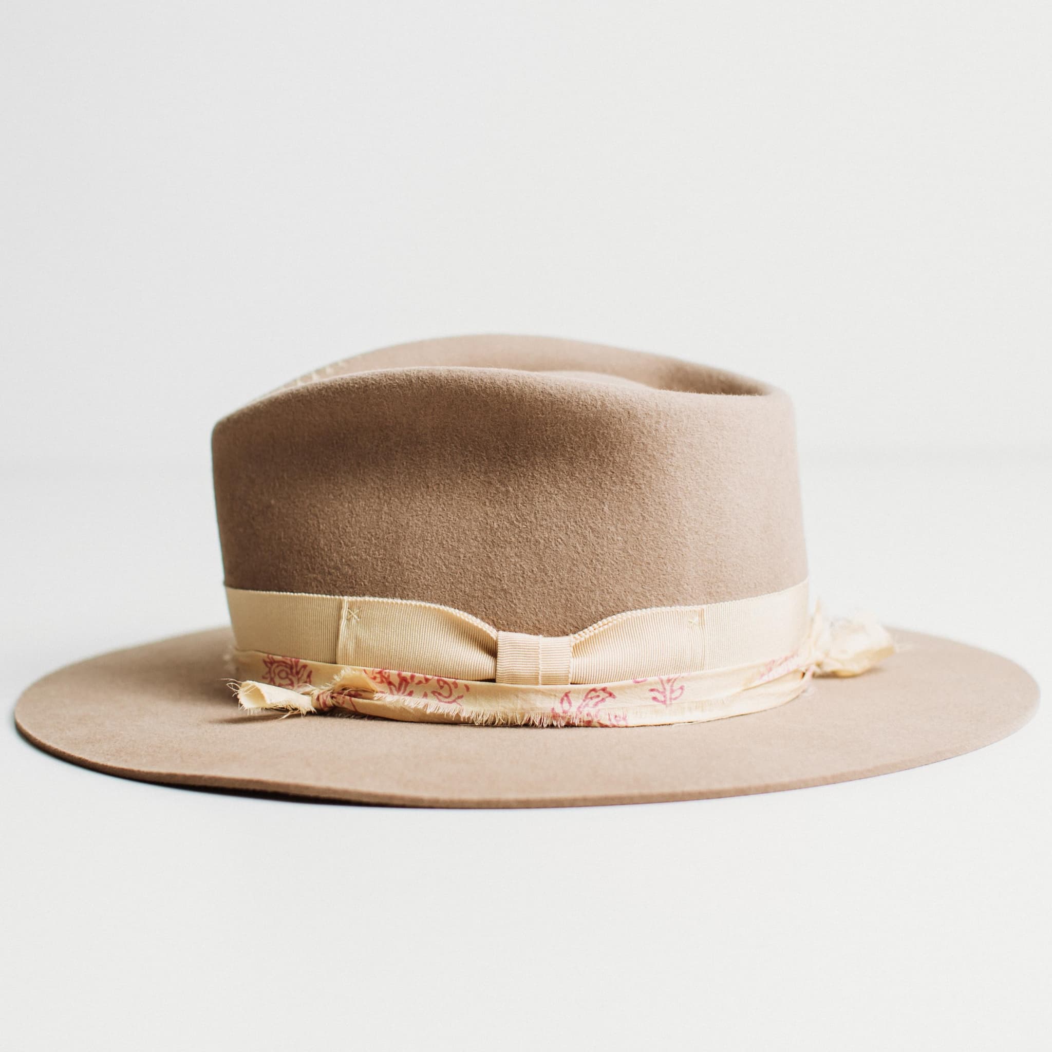 Left side view of sahara felt hat with Japanese grosgrain bow band and sari silk trim by PHYLLi Designs.