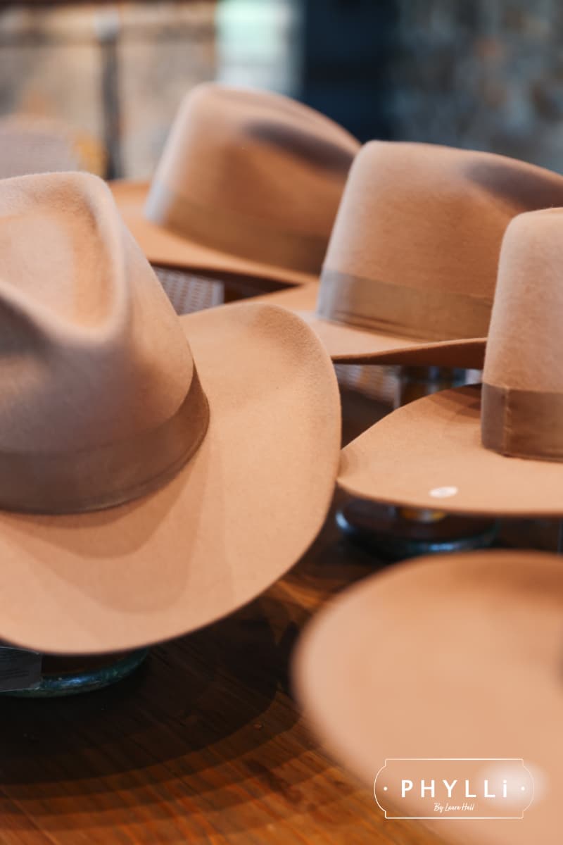 Collection of felt hat bases ready for guests at a PHYLLi hat party styling workshop.