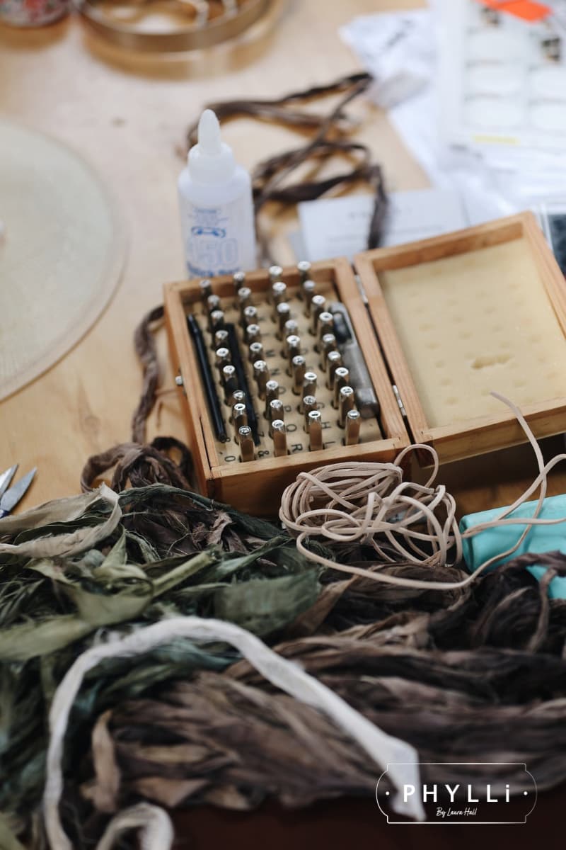 Hatmaking tools, silk ribbons and materials used in the PHYLLi custom hat styling experience.
