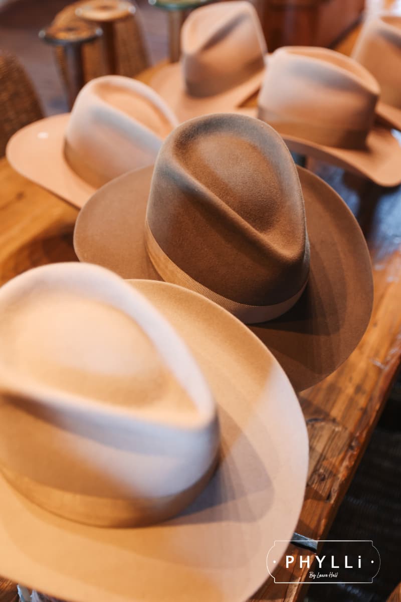 Selection of felt hat bases prepared for guests to choose from during a PHYLLi hat styling event.